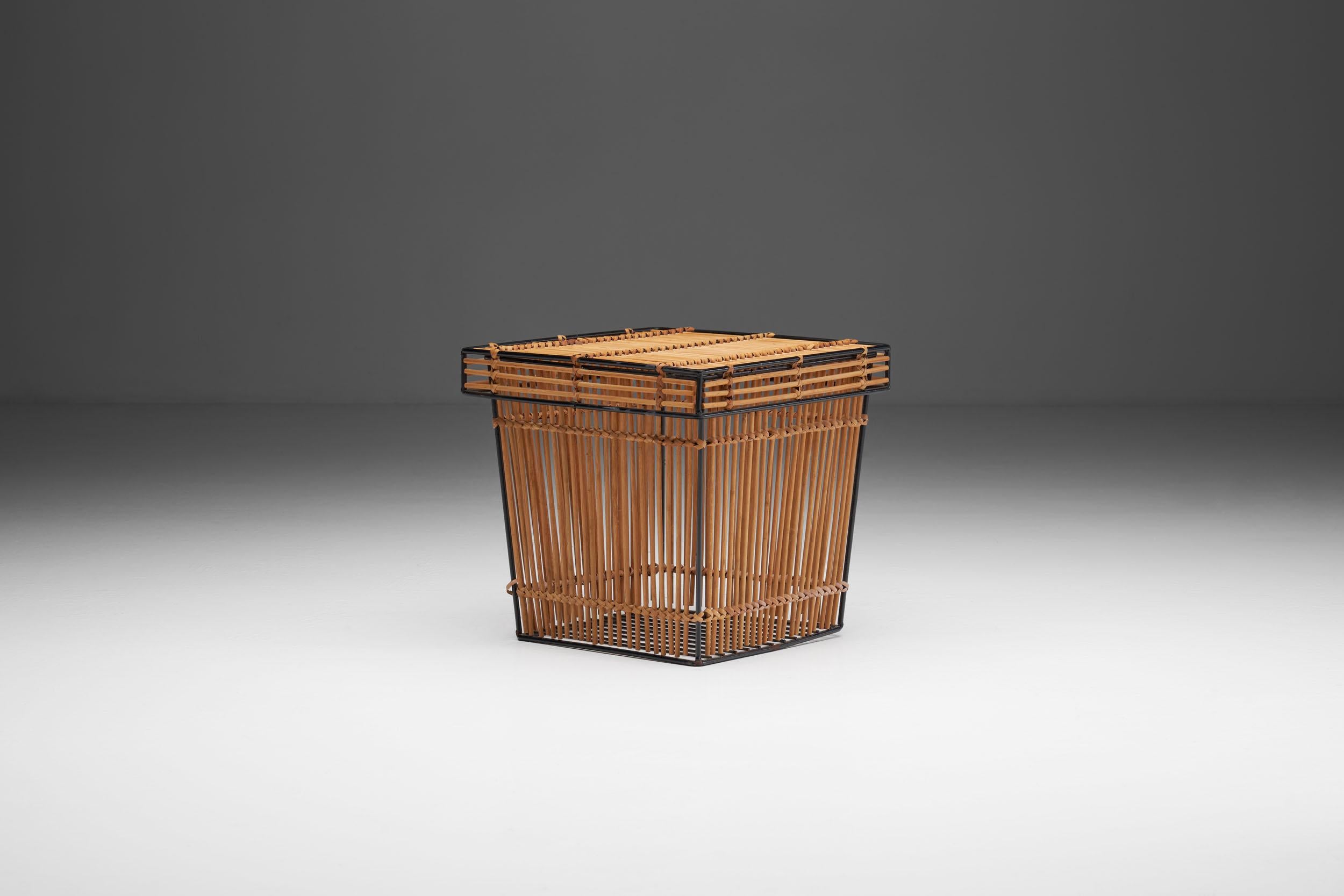 This rattan and steel basket is attributed to Dutch designer, Dirk van Sliedregt, and was manufactured by Rohé Noordwolde in the 1960s.

The Rohé basket has a metal structure covered in wicker. The organic material is carefully woven around the