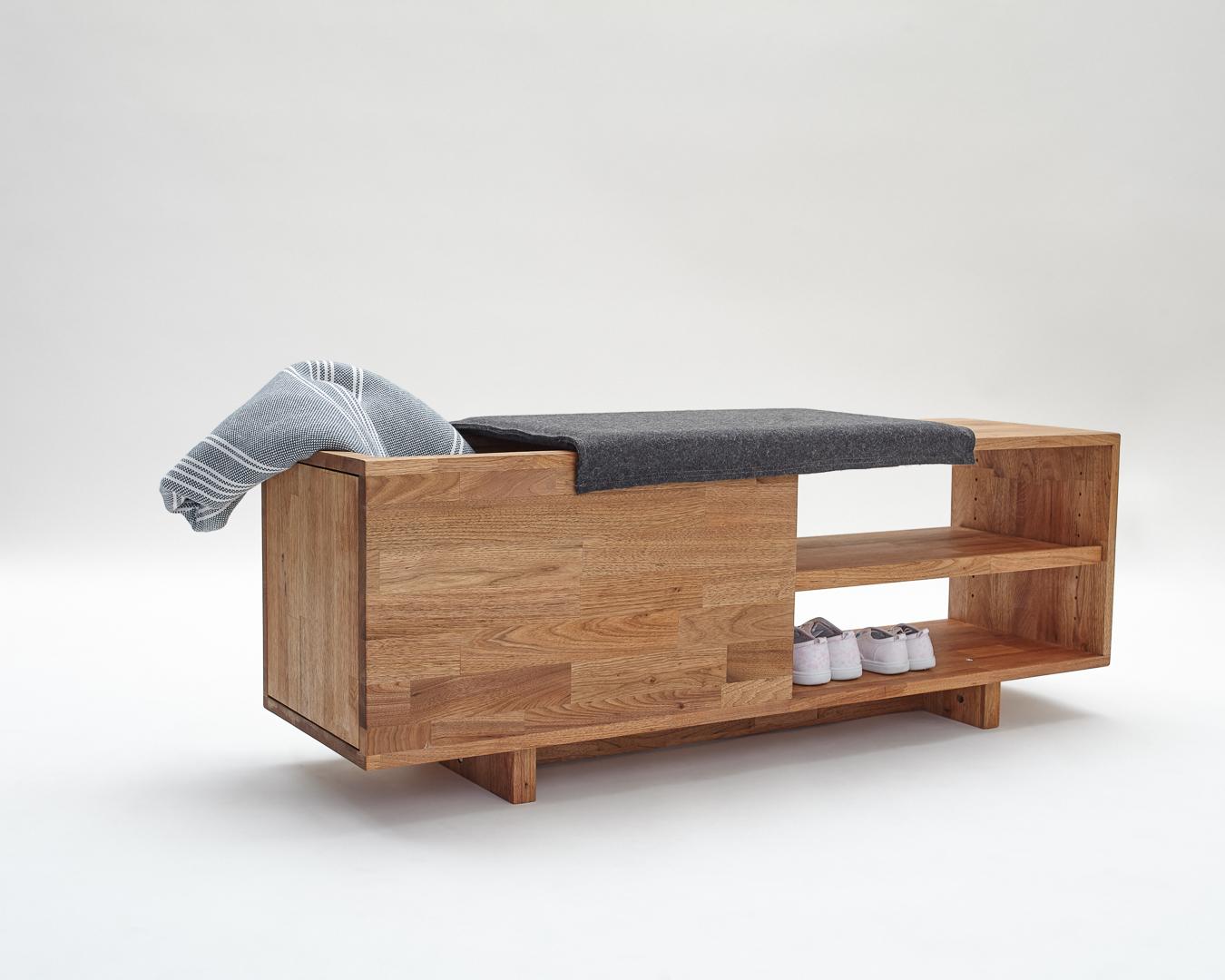 Expertly crafted using the highest quality English Walnut, the LAXseries Storage Bench is sleek and sophisticated. It incorporates a comfortable and convenient sliding padded seat to conceal a spacious storage compartment within. The two shelves