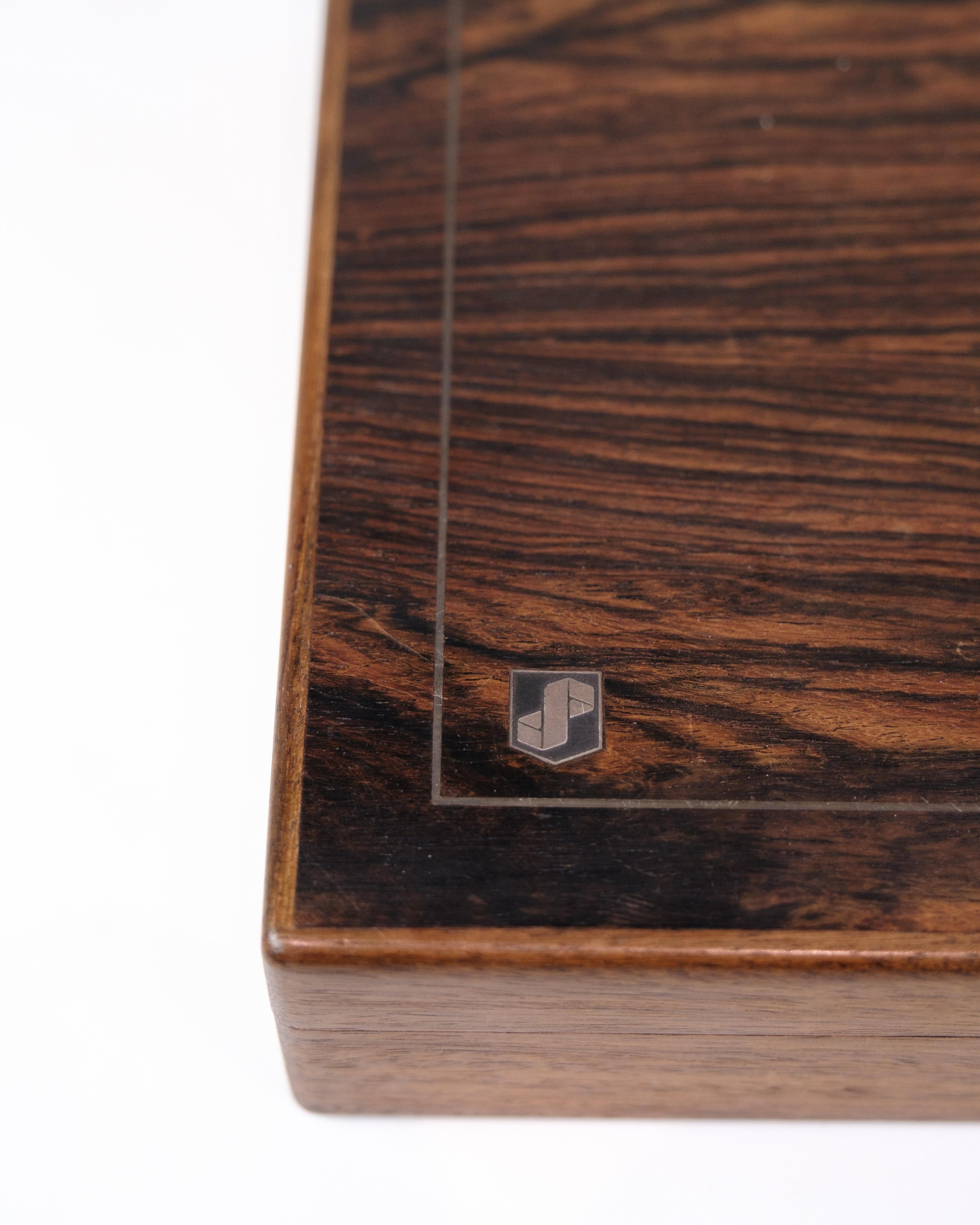 Vintage storage box in rosewood with original inlay “Provinsbanken”, circa 1960s. Danish design with adjustable compartments.

Material: Rosewood
Origin: Denmark
Production: Circa 1960s
Condition: Appears in nice vintage condition
Dimensions: H: 6cm