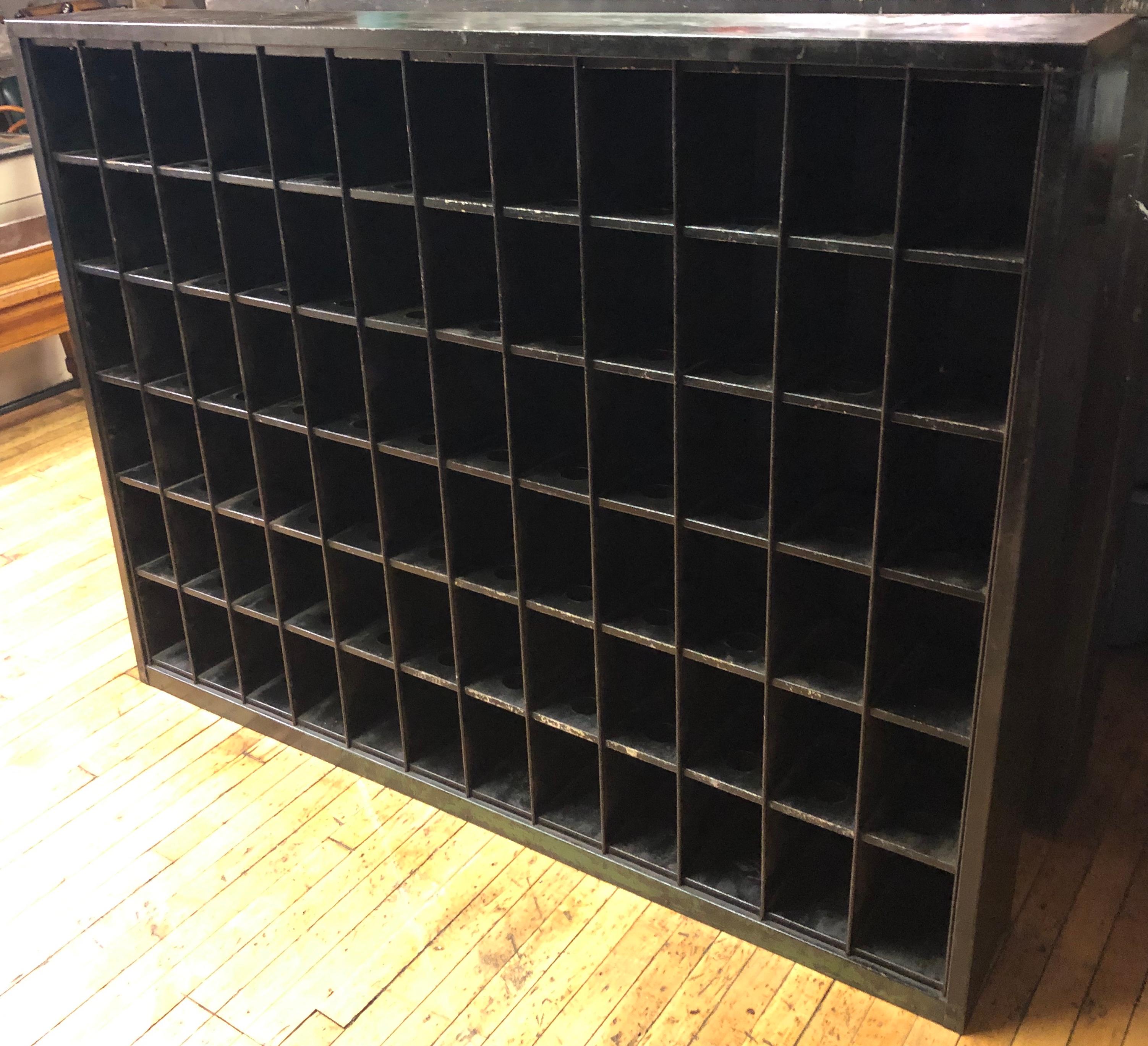 Storage cabinet of painted steel with 72 cubbies. Each measures 5 inches wide x 8 inches deep x 7 inches high. Ideal as a wine rack, DVD/CD storage, small size paperback books and the myriad items of a life's worth of collecting. Guaranteed you will