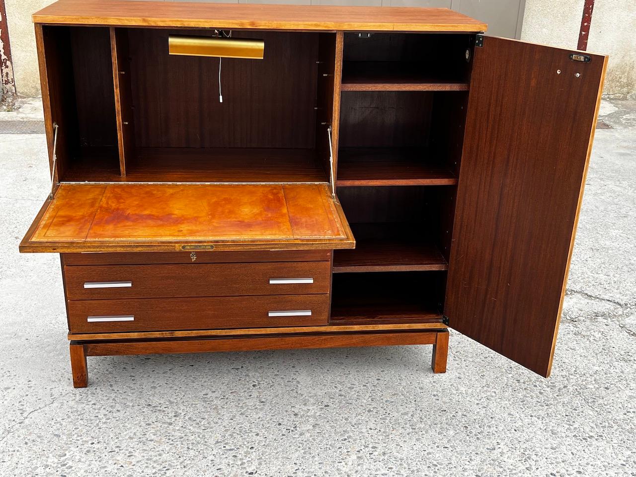 Storage unit with integrated desk / secretary, resting on a wooden base Light in the Marcel Gascoin office part for Alvéole 1950. Good general condition