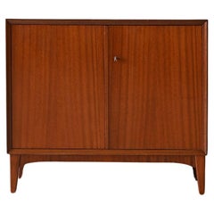 Storage cabinet with hinged doors