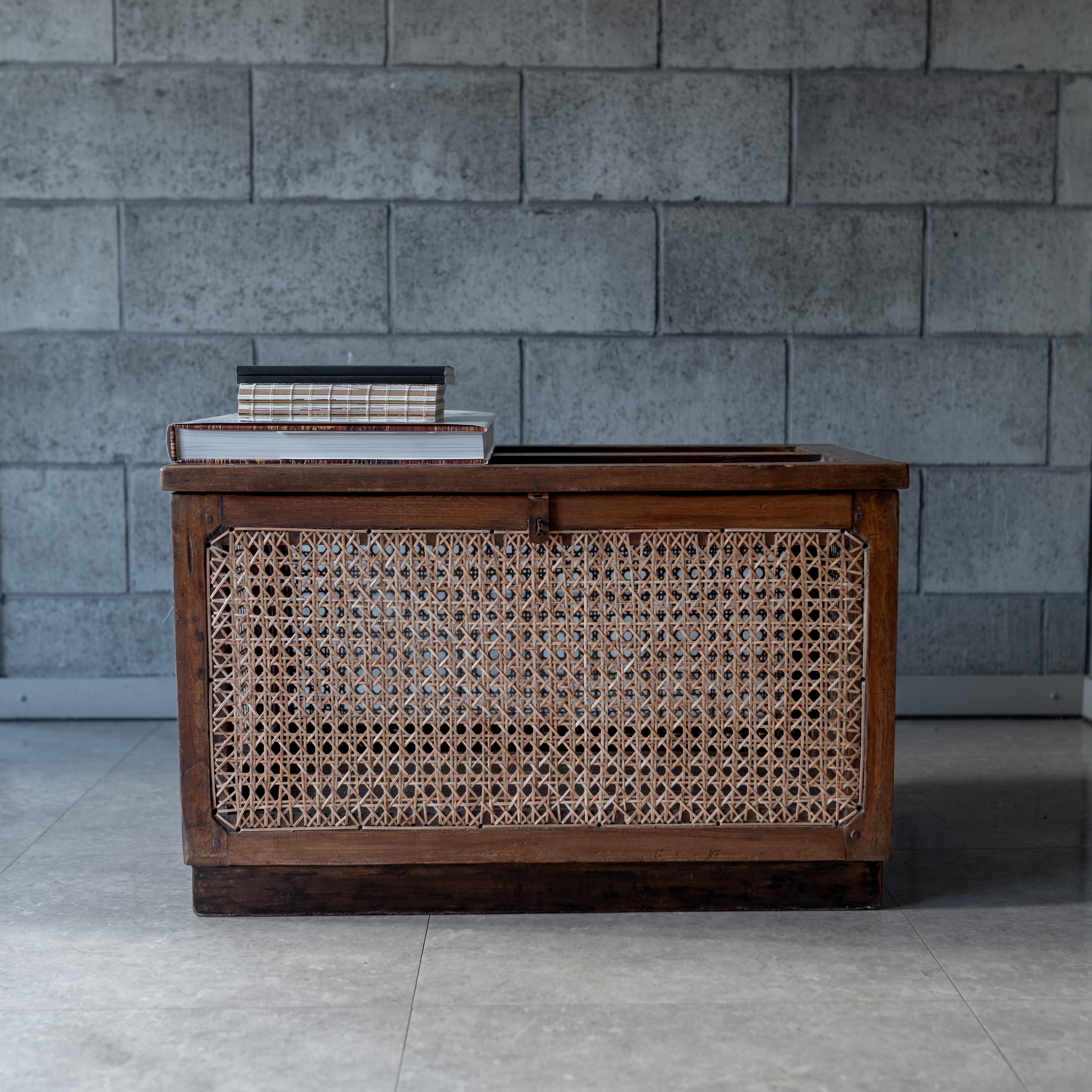 The linen storage chest, usually  called as  “Dirty Linen basket”, circa 1955-1956. This box was designed by Pierre Jeanneret in the mid-century for the M.L.A. Flats building in Chandigarh.

Delicate handcrafted piece, combining wood and rattan,