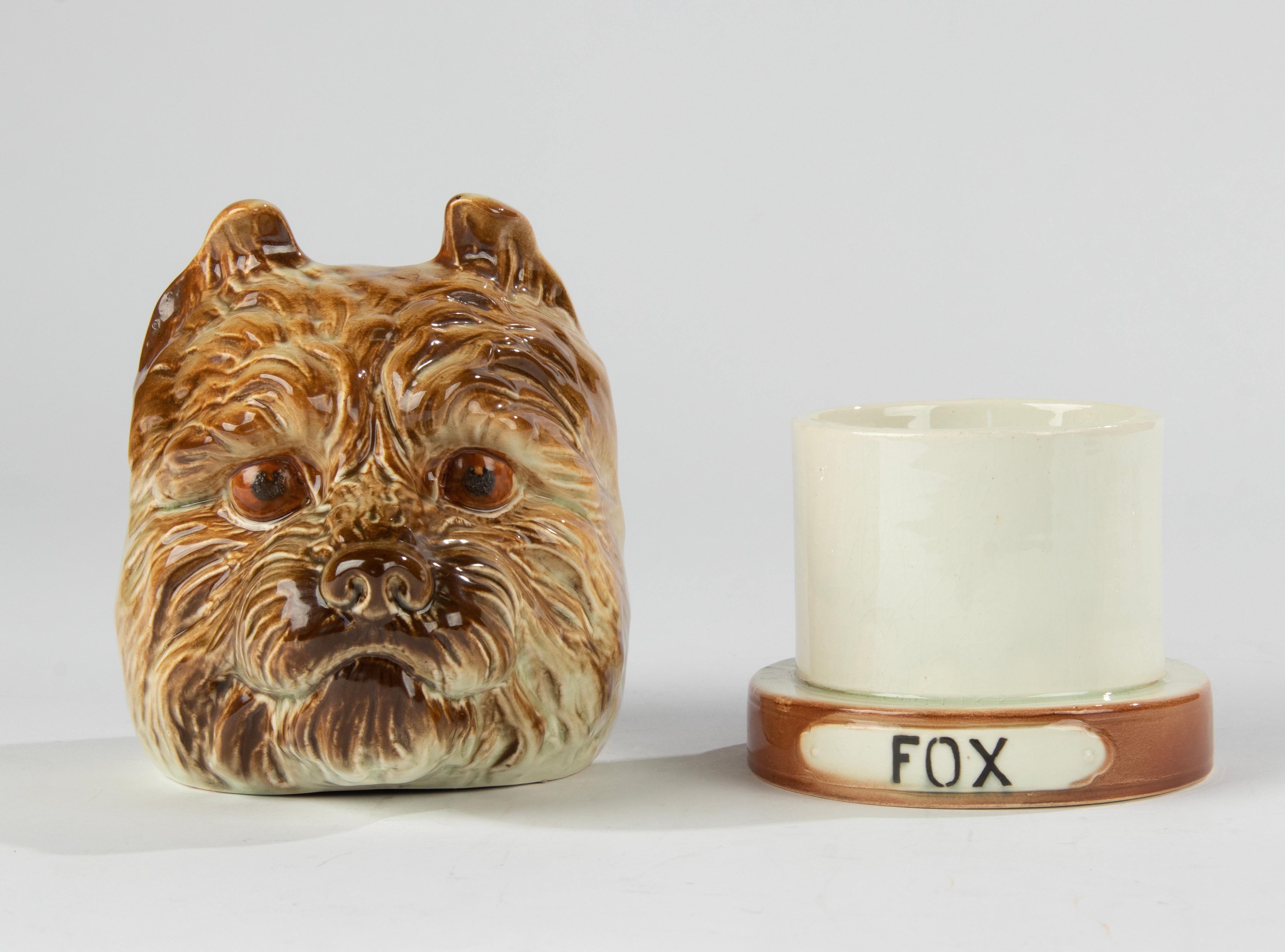 A lovely antique ceramic tobacco jar, shaped as a fox terrier. 
The bottom is marked France, probably made by Sint Clément. 
The jar is in good condition. No chips and no hairlines. Beautiful glaze. 
This item will be packed with great care.