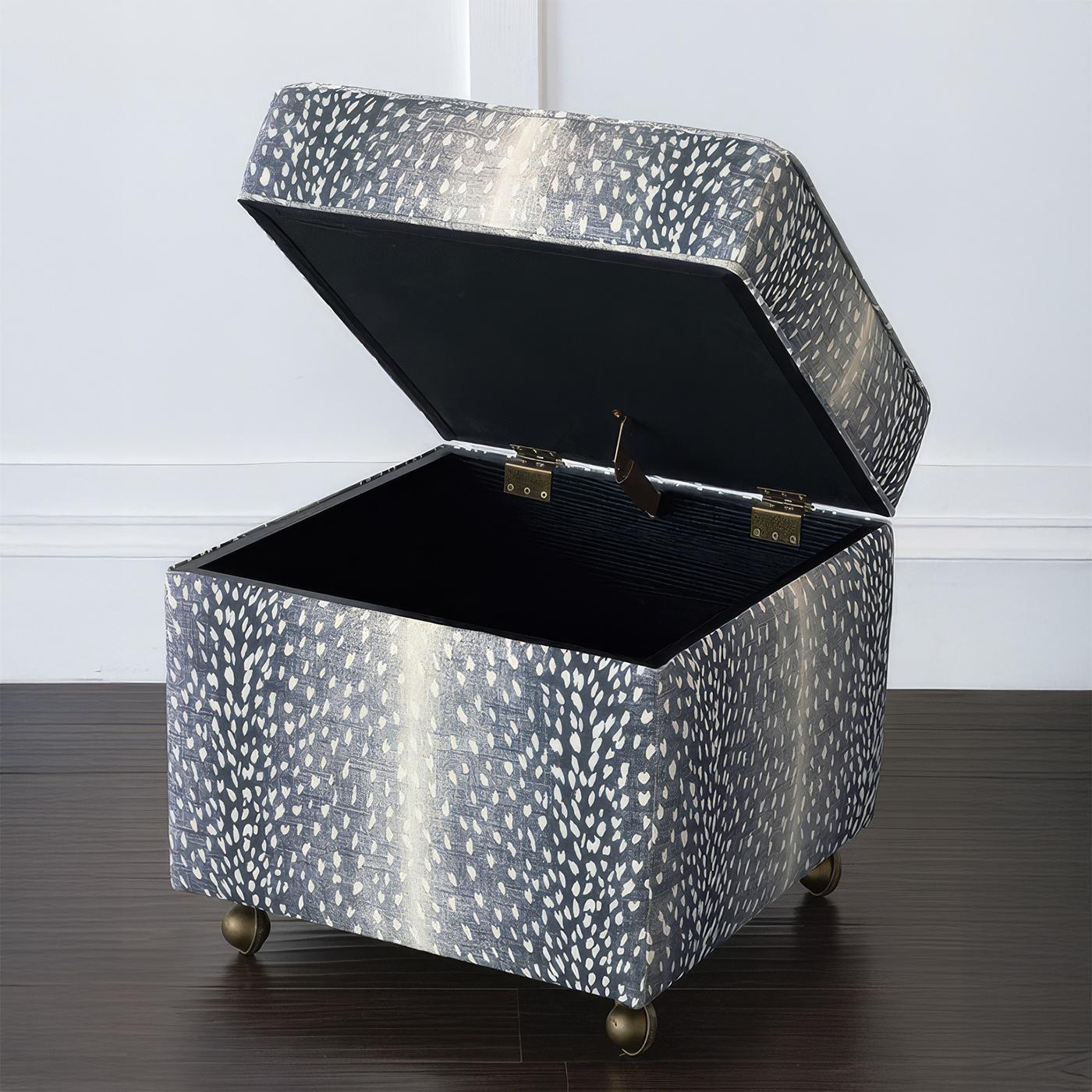 Made in the USA, this compact ottoman is thickly padded and tightly upholstered in a striking ombre navy fawn print, offering a chic yet nature-inspired aesthetic. Designed at an ideal vanity height, it provides both comfort and versatility in any