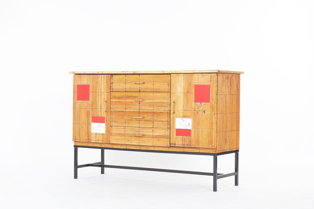 Storage made in France in the fifties
In the manner of one model from designers Adrien Audoux and Frida Minet and ceramist Roger Capron
Structure in black lacquered metal, base covered with rattan, black laminate top
In front, 2 doors and 4
