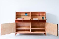 Storage unit with front in grinded wood