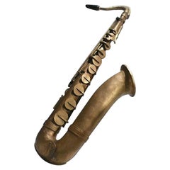 Signe de magasin des années 1940, anglais représentant un grand Saxophone