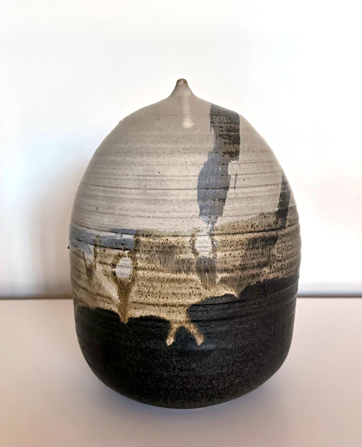 A fantastic ceramic closed-form pot with rattle by Japanese American artist Toshiko Takaezu (American, 1922 - 2011). 
The story: In the 1980s, potter Lola Rae invited Toshika to her ceramic studio and kiln in Ojai, CA to teach a class. Lola Rae had