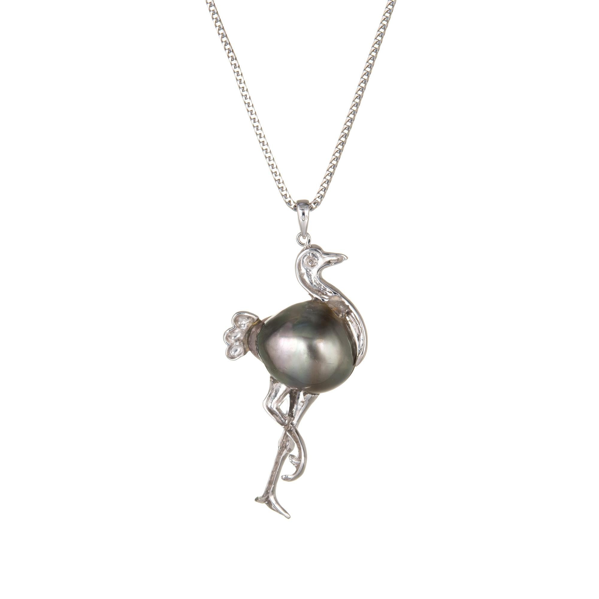 Stylish & unique stork pendant & necklace crafted in 14k white gold.  

Black baroque pearl measures 17mm x 13.5mm. One estimated 0.01 carat diamond is set into the eye (estimated at I-J color and SI2 clarity). 

The stylish pendant features a