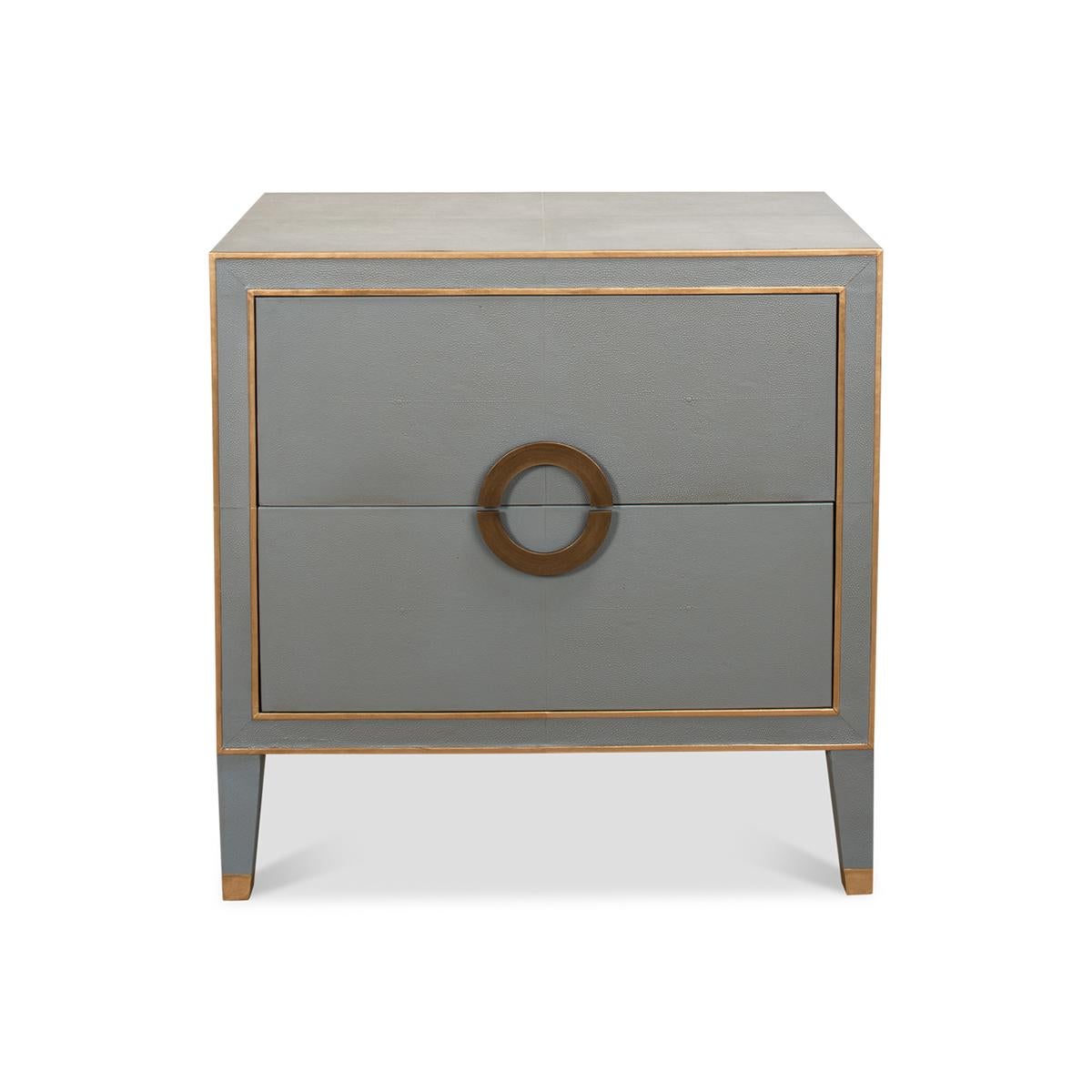 This piece combines functionality with unparalleled style, creating a statement of transitional elegance.

The standout feature of this nightstand is the soft, grey hue that perfectly contrasts with the elegant golden accents, bringing a touch of