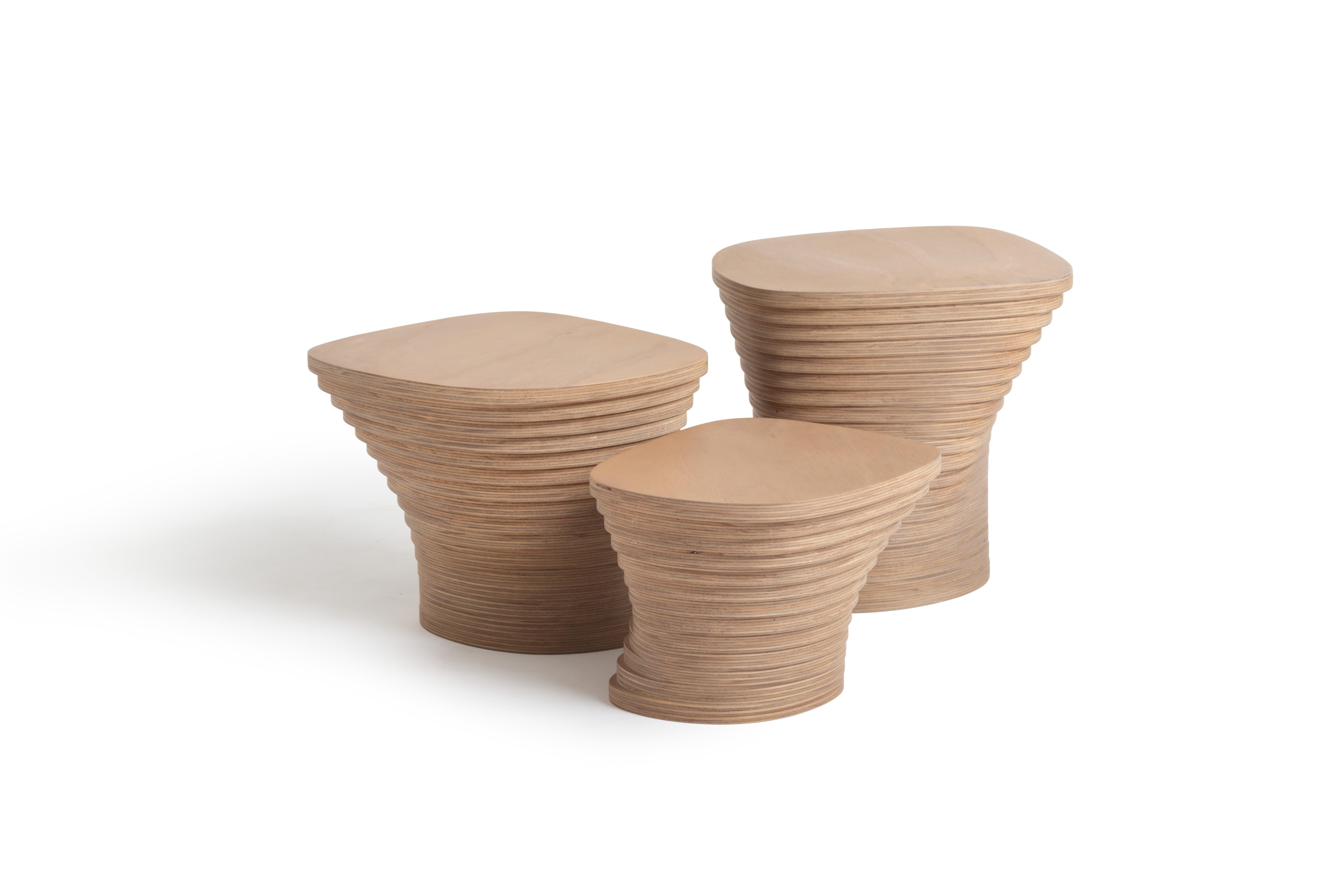 Table made with horizontal sections of laminated birch and spruce wood (18.5 mm thickness each). Matt finish with stain and exterior polyurethane coating. Inspired on the elliptical shape of a storm.

Embodies the raw energy and captivating beauty