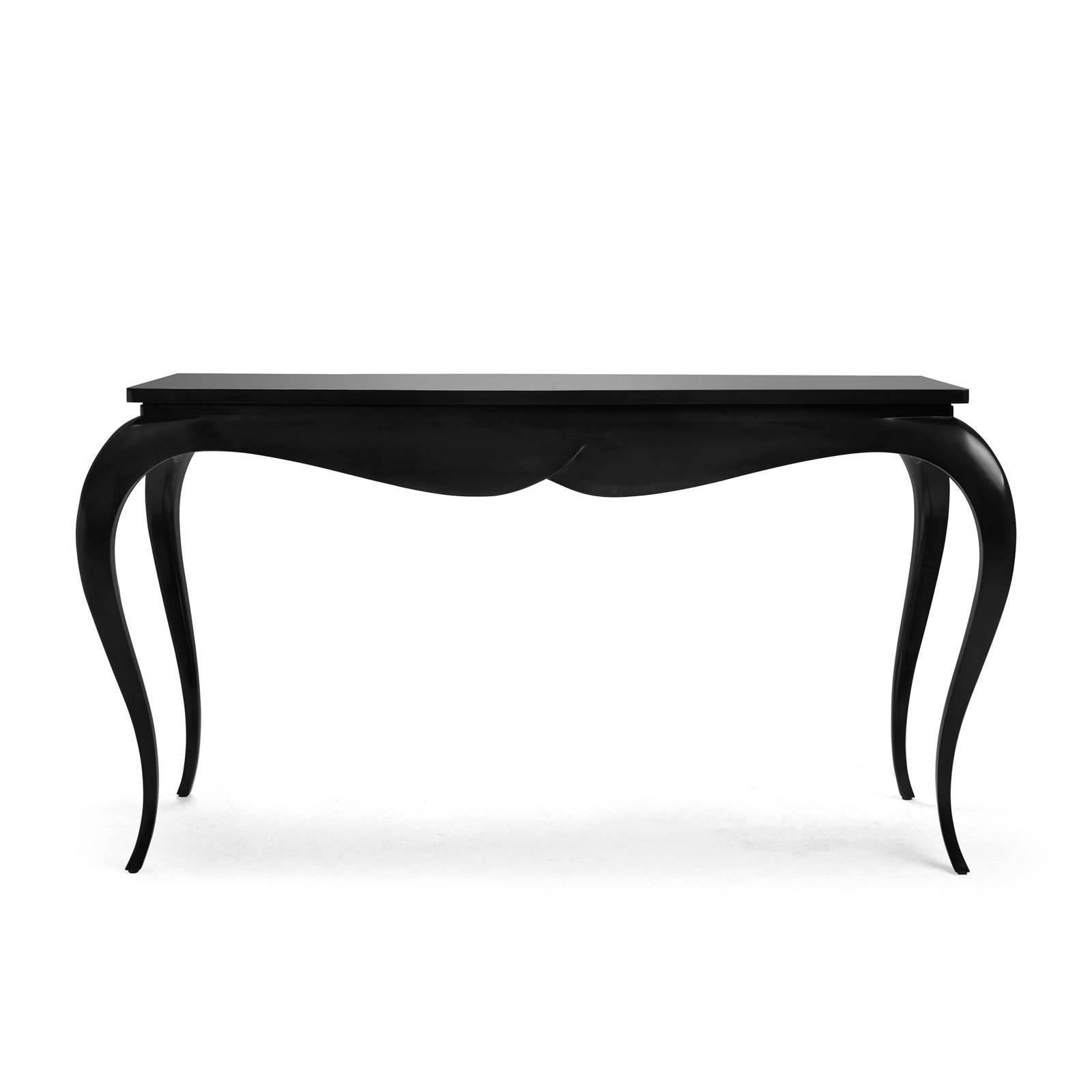 Console table stormy with hand-carved
structure in black veneered mahogany wood.
 