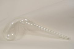 Transparent blown glass laboratory retort from the early 19th century.