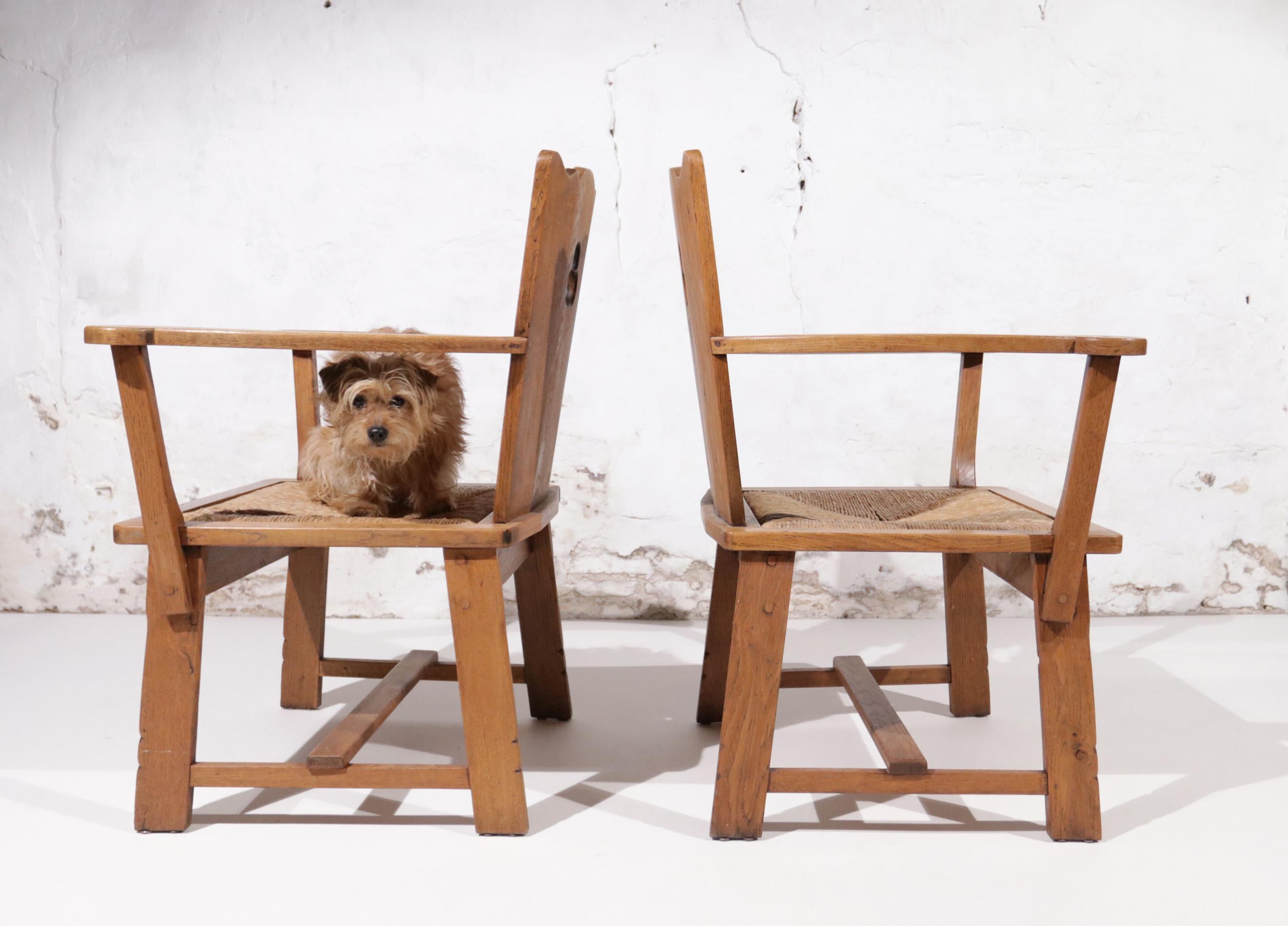 Story Book Pair of Dutch Brutalist Oak and Rush Throne-Like Lounge Chairs For Sale 1