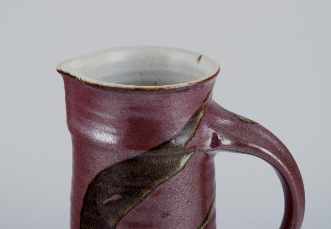 Danish Stouby Keramik, Denmark. Ceramic jug with glaze in brown and sandy tones For Sale
