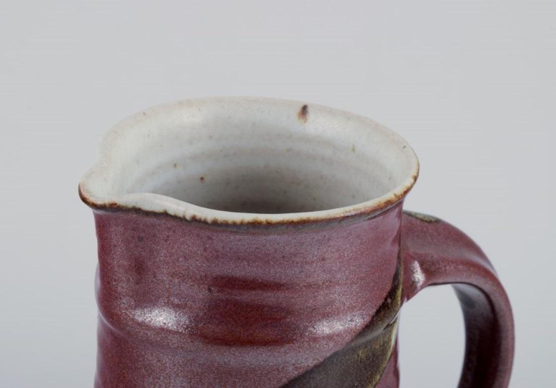 Glazed Stouby Keramik, Denmark. Ceramic jug with glaze in brown and sandy tones For Sale