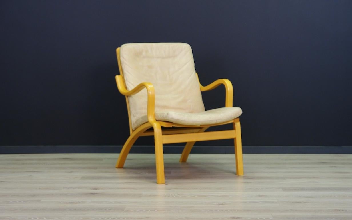 Retro armchair from the 1960s-1970s, Scandinavian design from the Stouby manufactory. Item upholstered with the original leather. Preserved in good condition (Small signs of wear on the leather and small scratches on the construction) - directly for