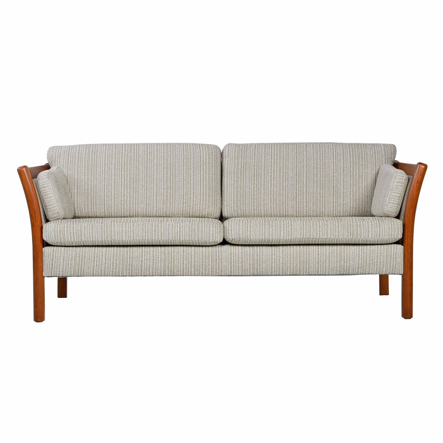 Super comfortable, fully restored, Danish Modern teak Stouby settee. Still doing business after over 100 years, Stouby’s Scandinavian quality rings true in the design of these chairs. Frames constructed of bent, teak wood. Masterfully engineered to