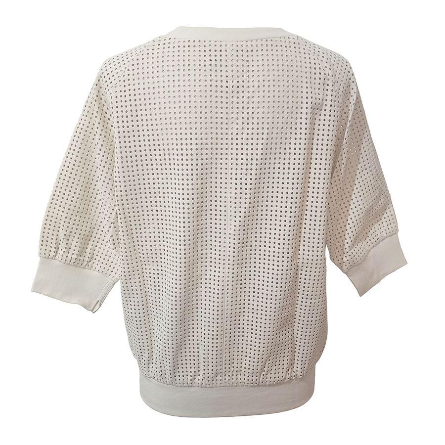 100% Lamb skin White color Perforated pattern Short sleeves Length shoulder / hem cm 58 (22,8 inches)
