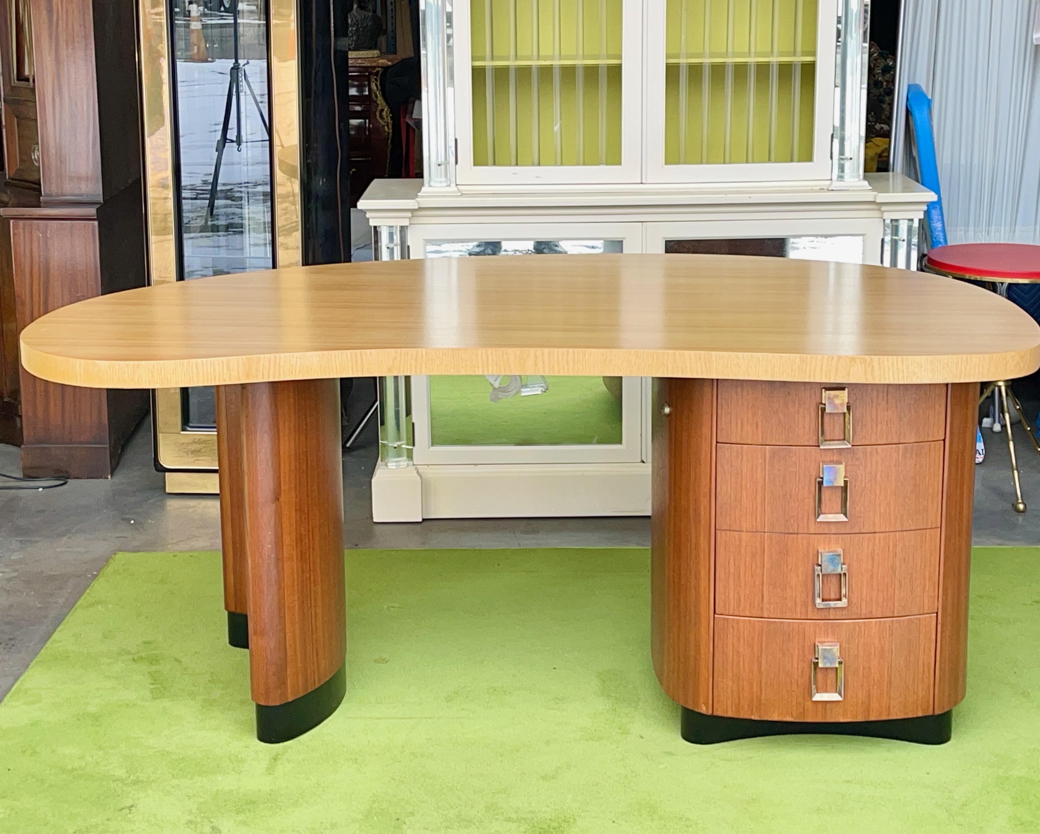Handsome late 1940's American Art Deco kidney shaped desk designed by Giacomo 