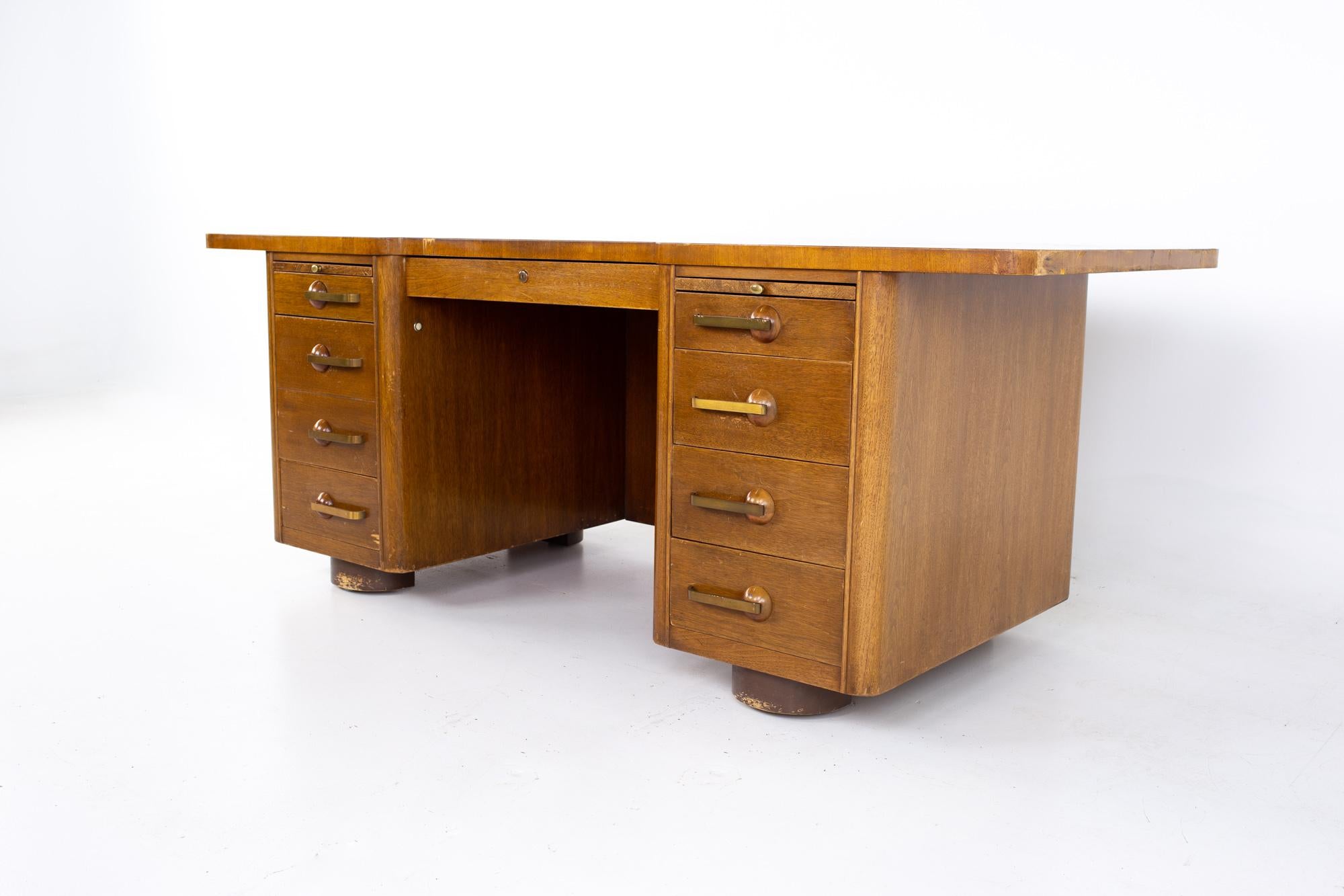 Stow Davis Mid Century walnut and brass executive desk
Desk measures: 76 wide x 38 deep x 29.75 inches high

All pieces of furniture can be had in what we call restored vintage condition. That means the piece is restored upon purchase so it’s