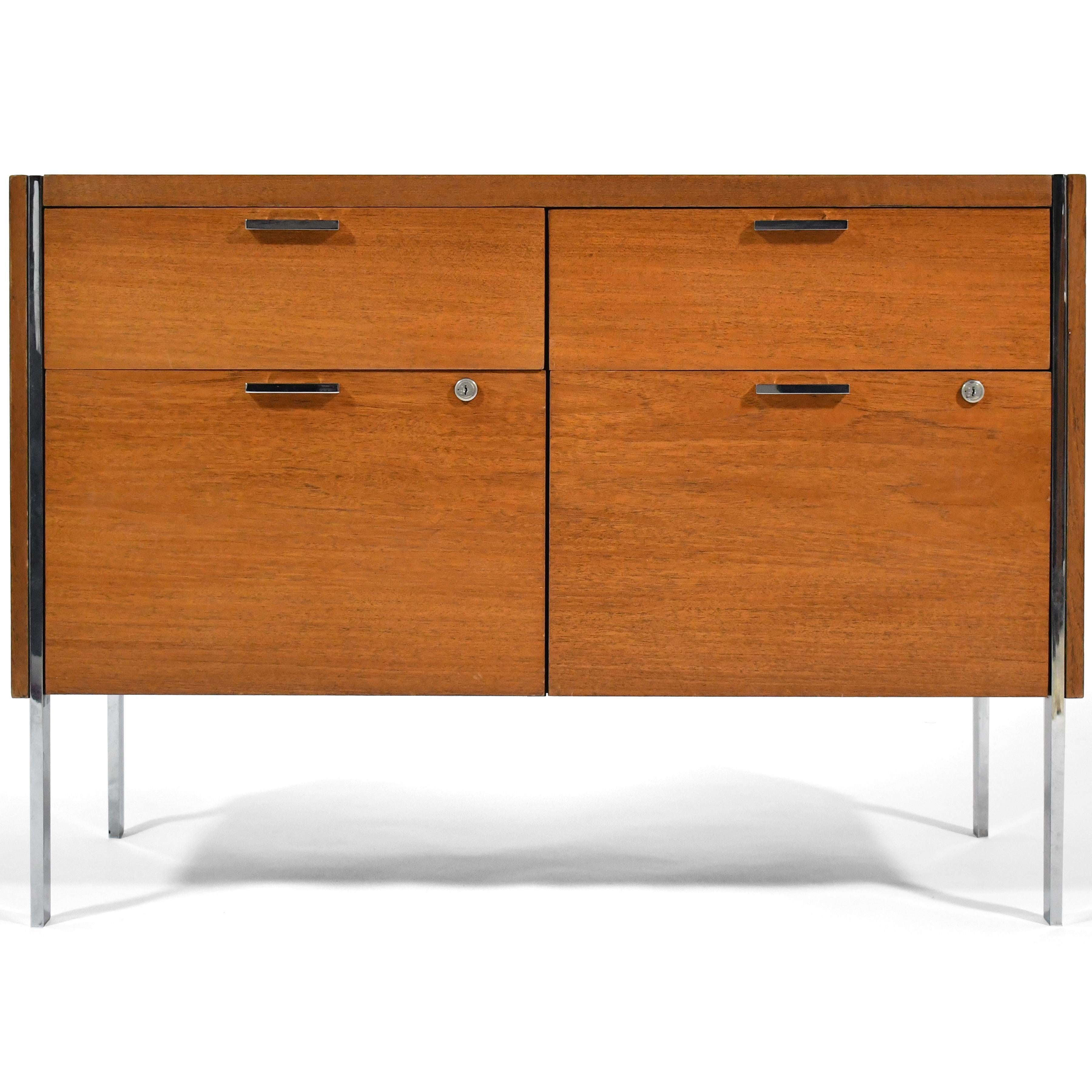 This handsome credenza by Stow Davis is extremely well built and chock full of pleasing details including flat stock legs that go through the teak case and the slender chrome pulls. It has two shallow drawers over two deep drawers.


28.75