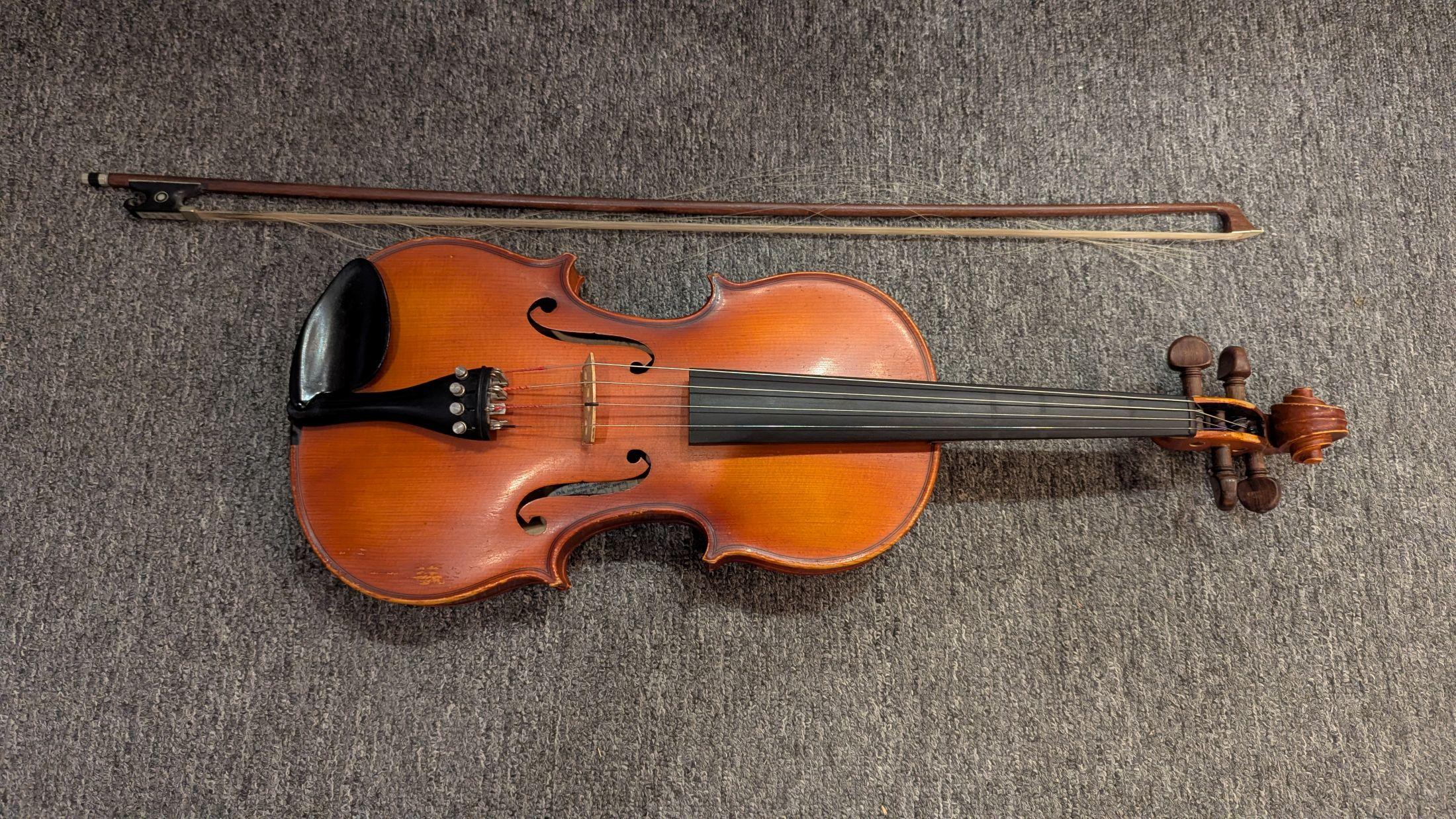 Very fine playing condition Stradivarius copy made of flame maple body and spruce neck. includes bow,  labels read as follows;
E. R. PFRETZSCHNER  Mittenwald OBB  1987  hand made copy of ANTONIUS STRADIVARIUS  West Germany
Scheri & Roth shop