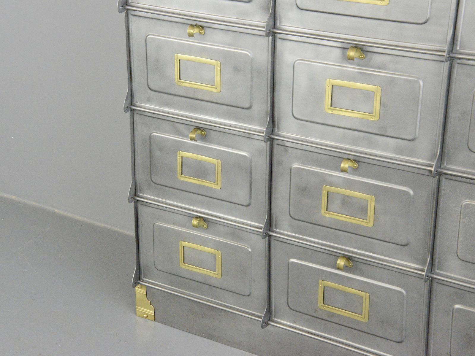 Strafor Clapets industrial cabinet, circa 1920s

- 21 pull down compartments
- Solid brass card holders each stamped 