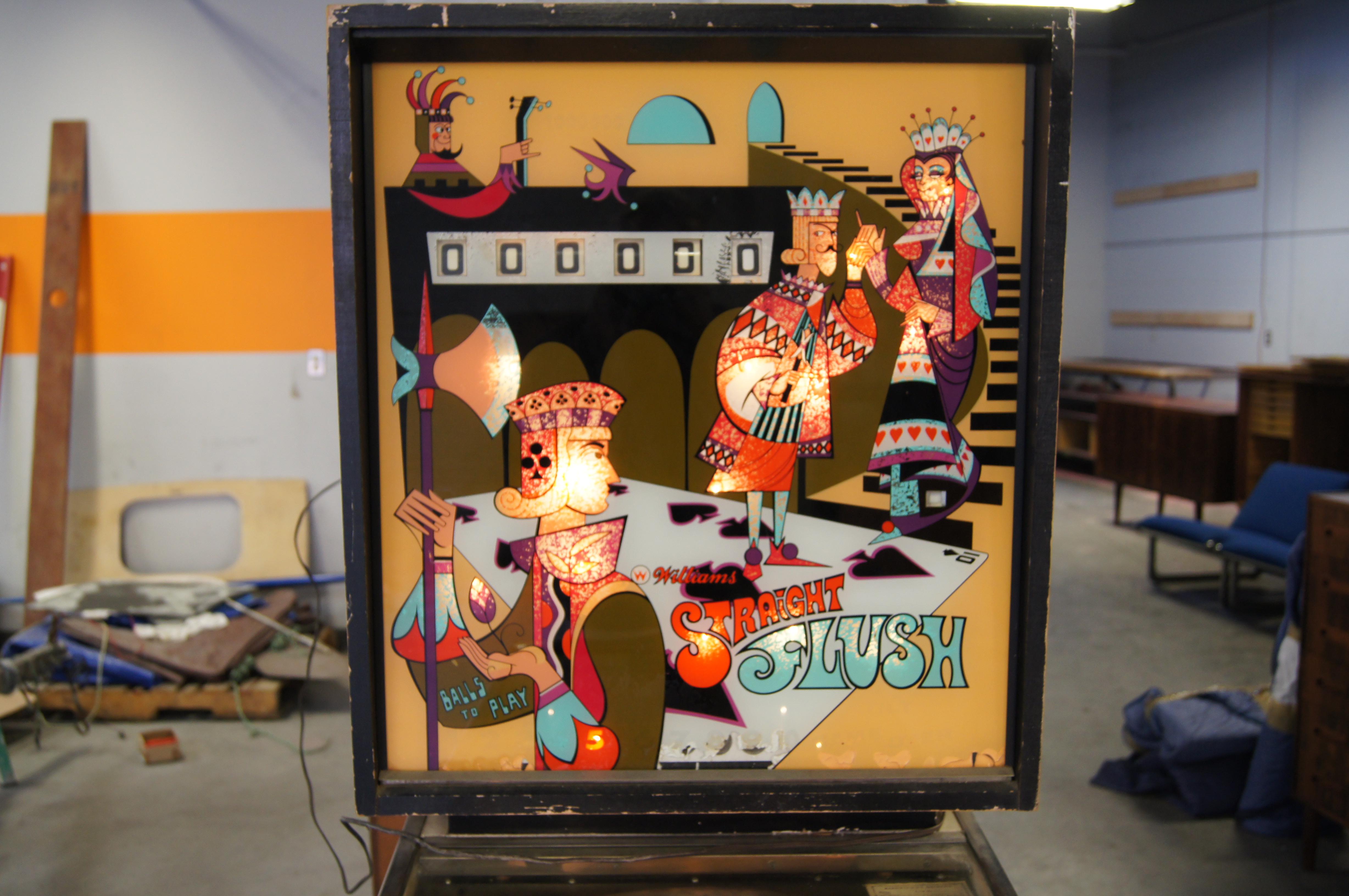 Manufactured in 1970 by Chicago-based Williams Electronics as model 389, with a design by Norm Clark and artwork by Christian Marche, Straight Flush is a poker-themed single-player pinball machine. It features two flippers, two slingshots, five pop
