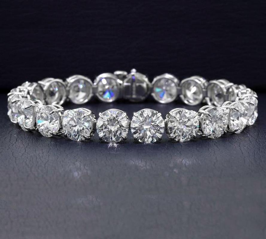 21 Round Brilliant Diamonds set in 18k 4-prong white gold straight line bracelet.
42.77 carat total weight
Measures 6.85 inches long