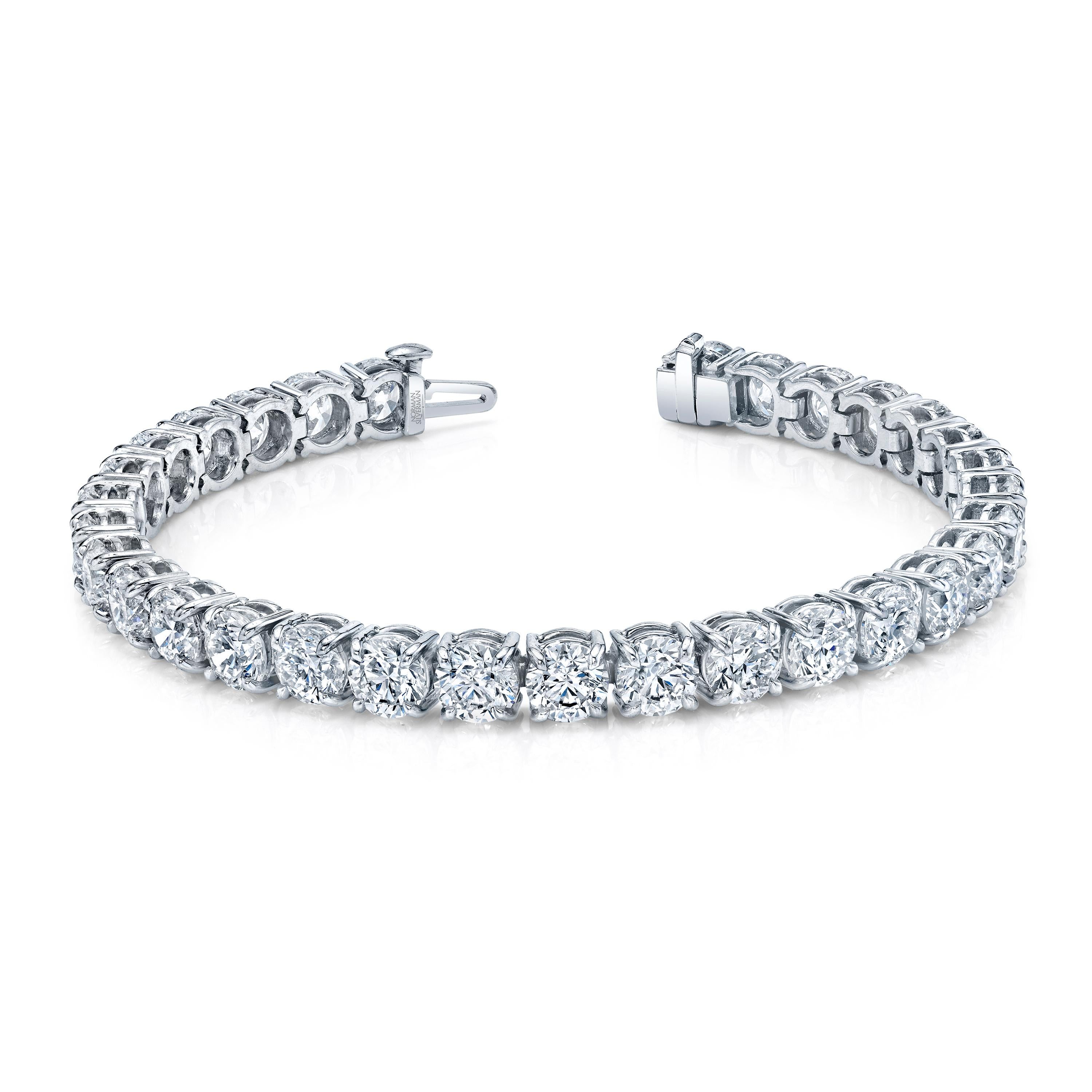 Straight Line 18k white gold bracelet with 31 round brilliant cut diamonds with a total weight of 21.92 carats.
Approximate Color G - H  Clarity  VSS1  
7 inches long
