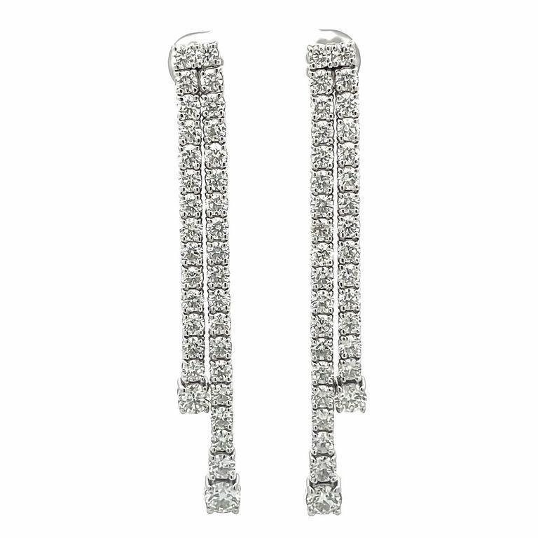 Are you looking for that perfect combination of glamorous and trendy? Look no further than this pair of fashion earrings. Crafted with precision in 14k white gold, these drop diamond earrings boast a stunning total of 8.27- carats of brilliance.