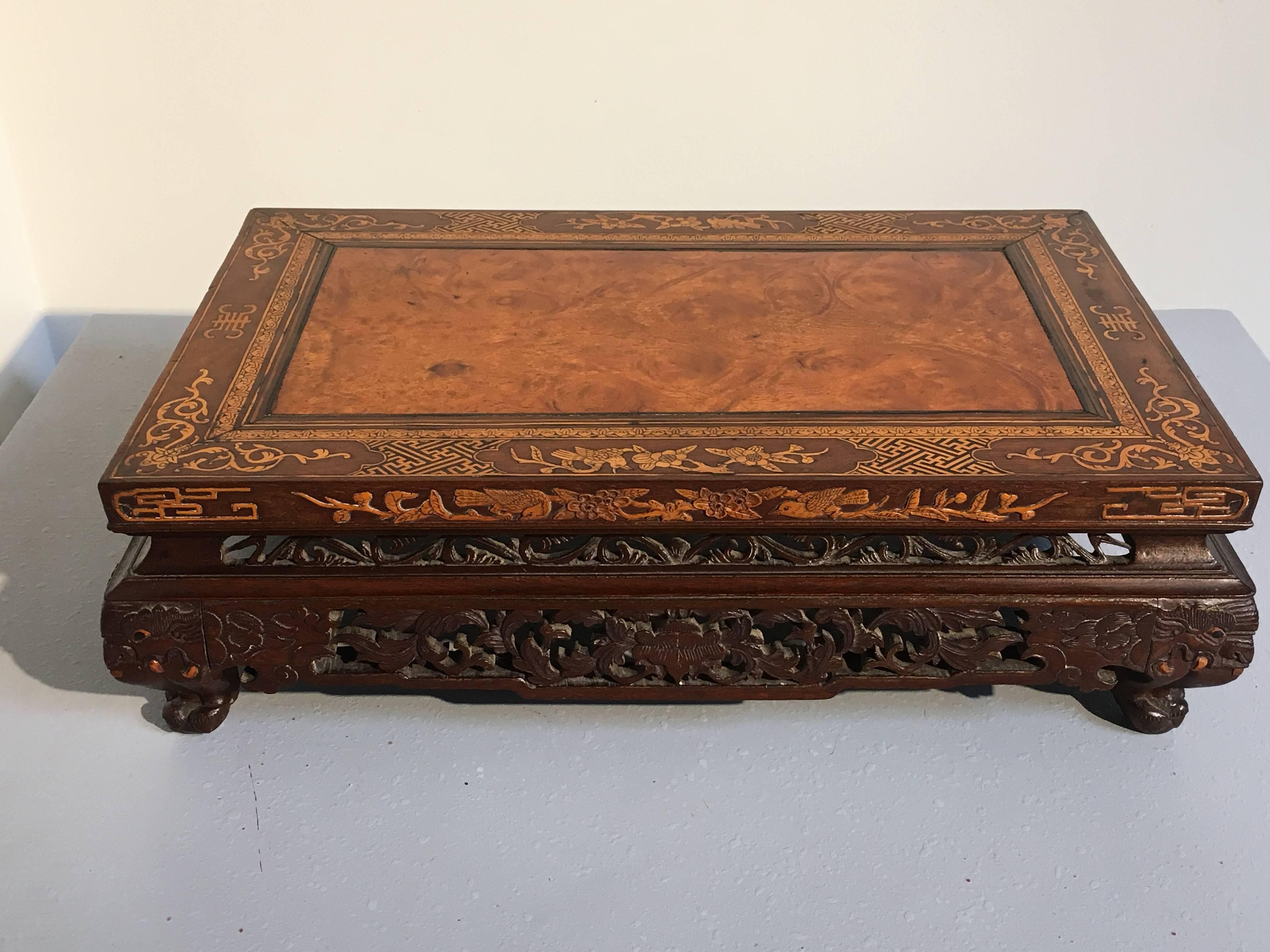 A remarkable straits Chinese (also known as Peranakan or Nyonya) carved hardwood and bamboo inlaid and embellished table-form stand, originally for display or incense, 19th-20th century.

The stand features a stunning floating veneer panel of