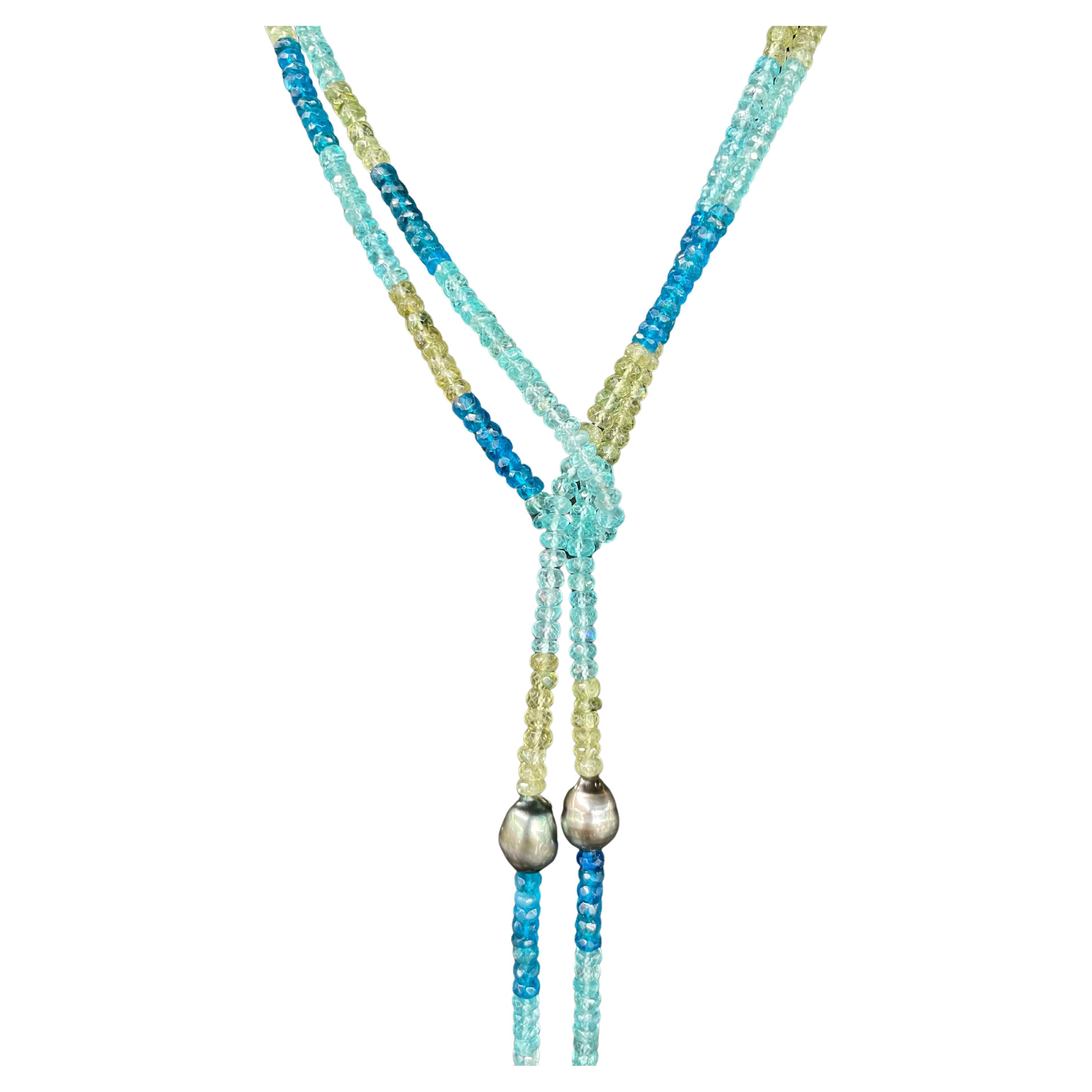 One strand of Apatite beads ranging from blue, teal and greenish yellow with 10 Tahitian Pearls measuring 12-15 MM, 50 Inches long.
