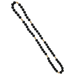 Strand of Black Onyx and 14 Karat Gold Spacers