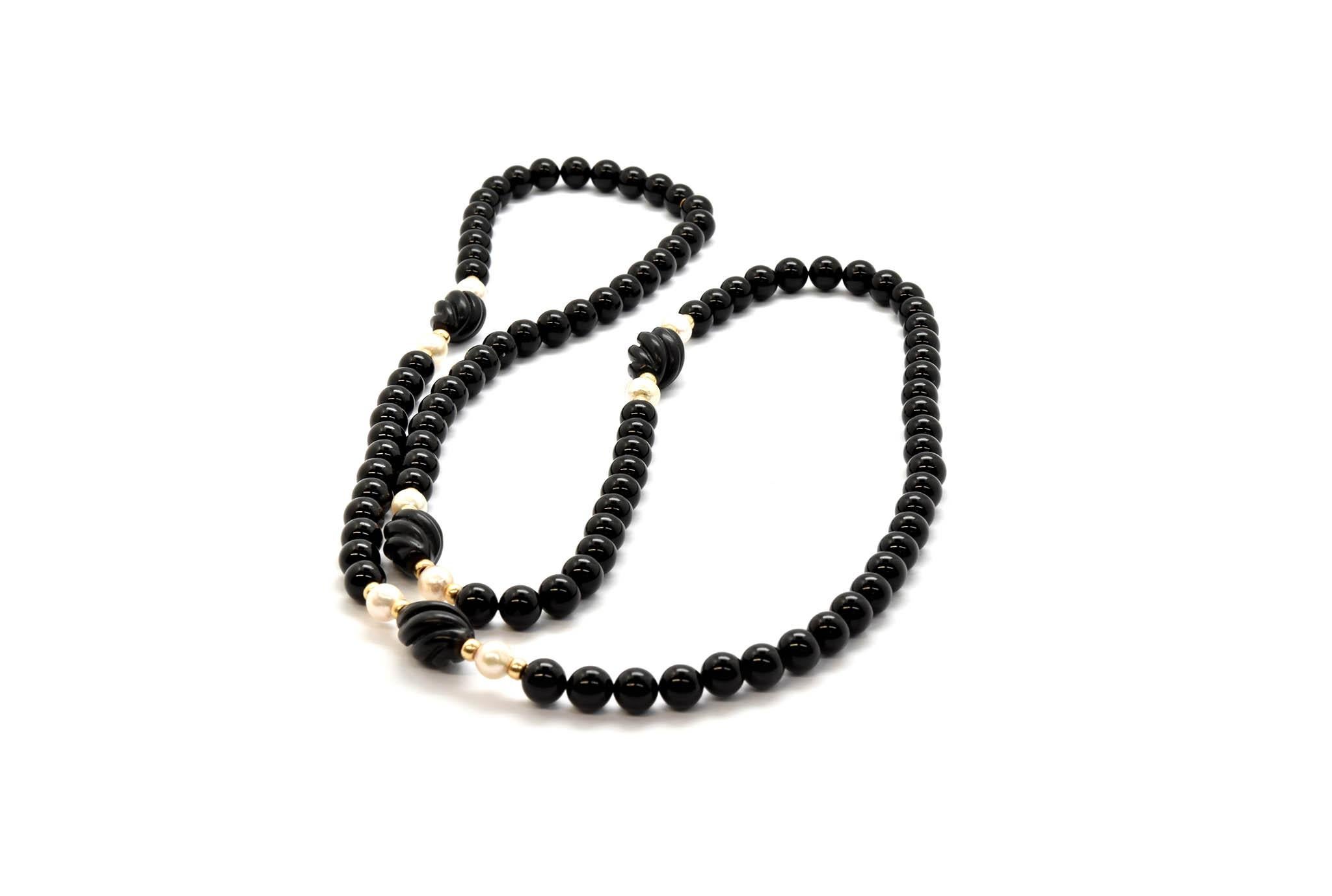 Strand of Black Onyx Beads with 14 Karat Yellow Gold and Pearl Accent Beads In Excellent Condition In Scottsdale, AZ