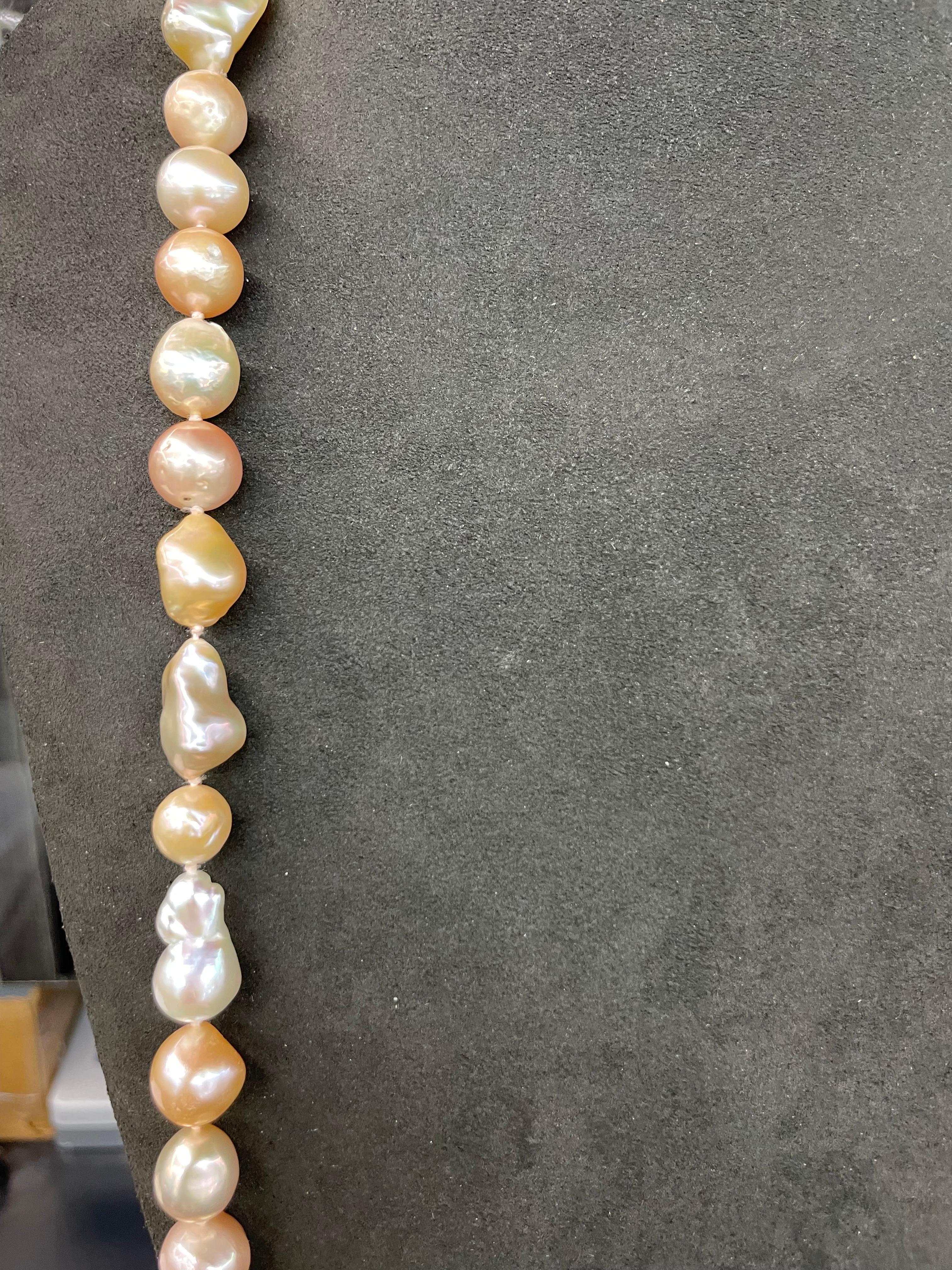 Contemporary Strand of Pink White Baroque Pearls 9-25 MM 42 Inches Long For Sale