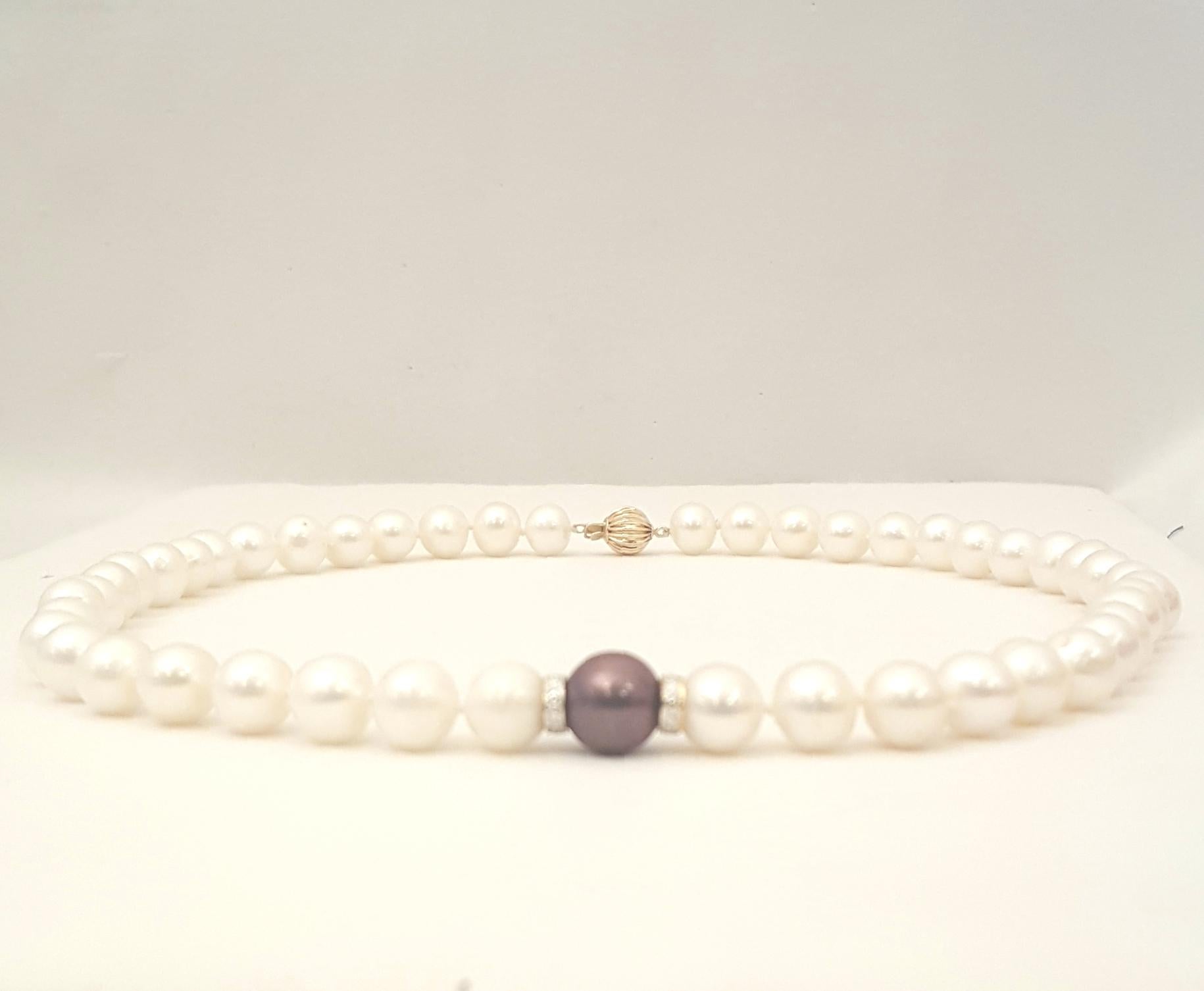 Perhaps the single most important piece of fine jewelry every woman needs.  Pearls are a necessity in one's wardrobe.  This strand of cultured white pearls measures 18