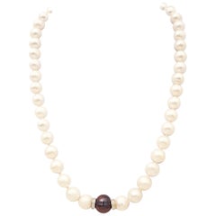 Strand of White Pearls One Black Pearl and Diamond Spacers Necklace w 14 K Clasp