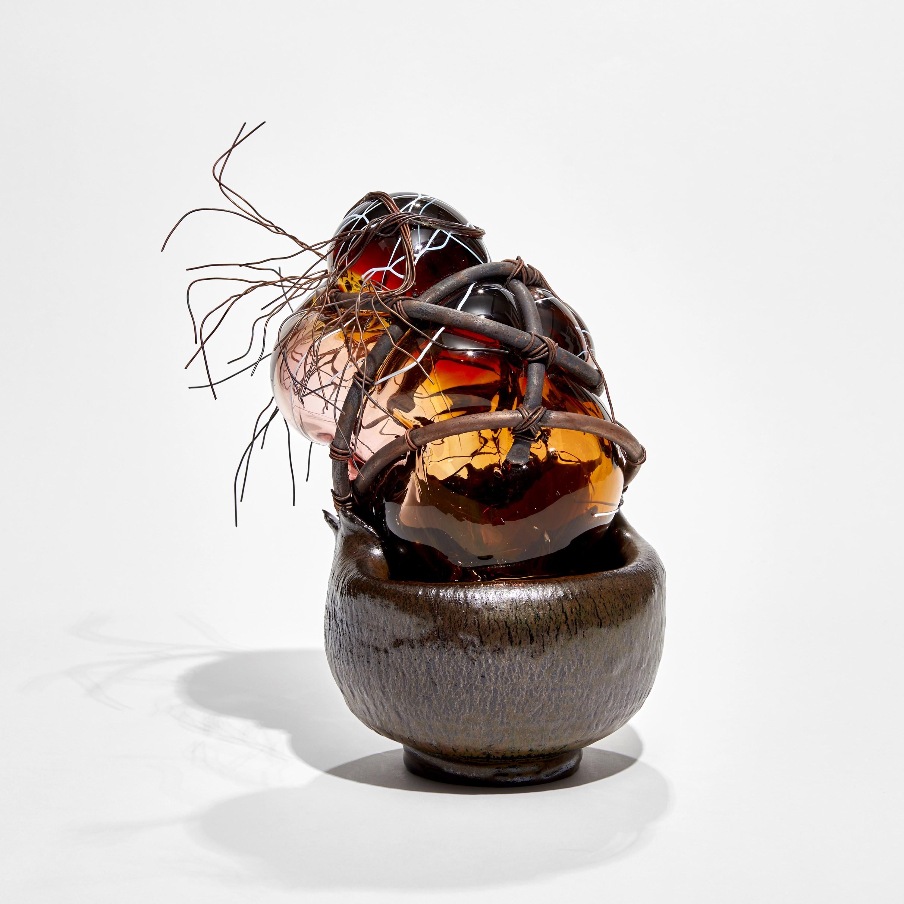 'Strange Fruit - The Congregation V' is a unique sculpture by the British artist, Chris Day, created from handblown & sculpted glass with terracotta, micro bore copper pipe and copper wire.

This piece was created as a part of the artist's ‘Strange