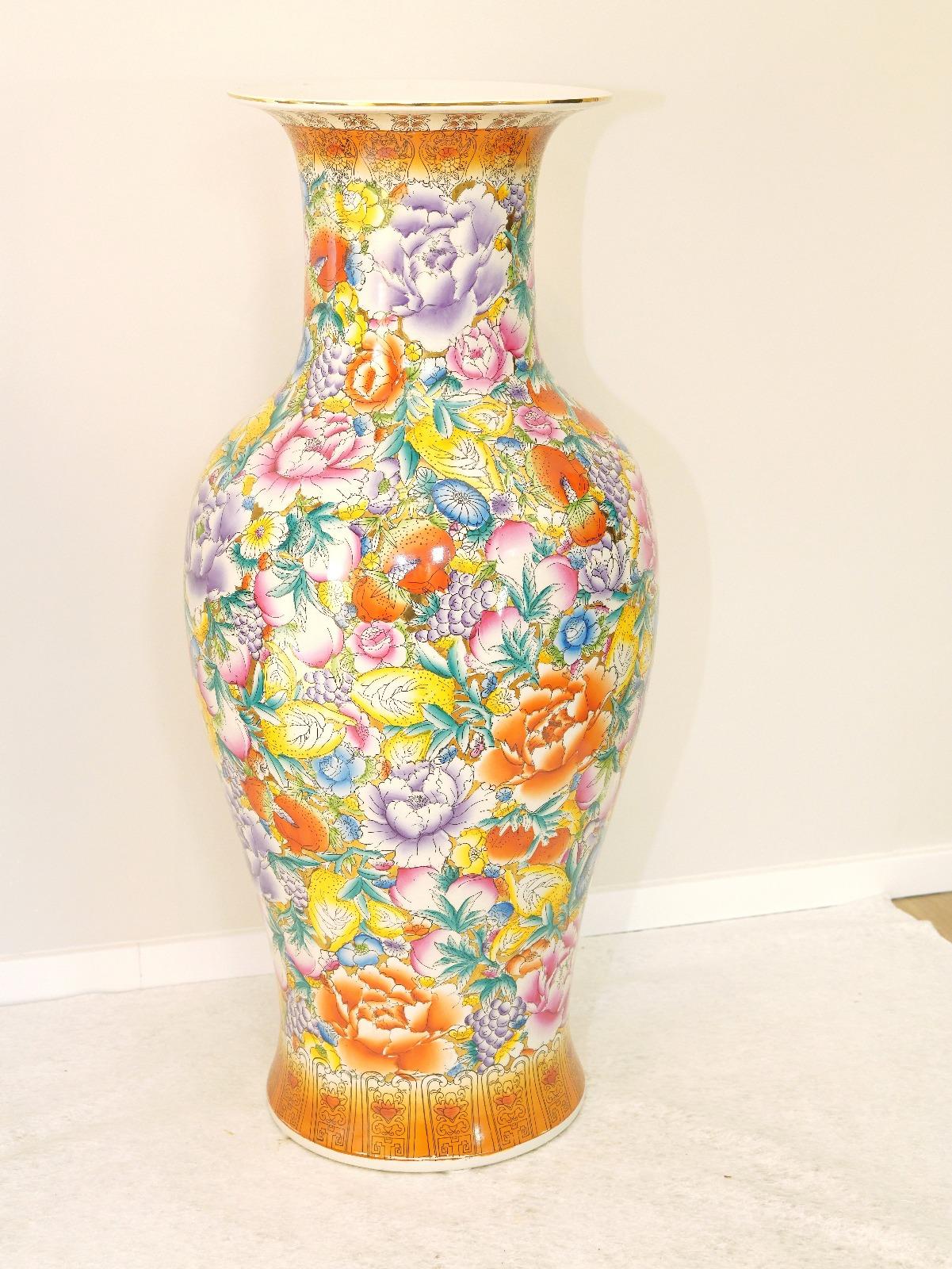 Extraordinary Pair of Chinese Vases, 20th century. 
Extraordinary Pair of Large Chinese Porcelain Export Vases with rich floral brightness and parcel gilding. This monumental piece for its color scheme could fit very well on any room, on hallway,