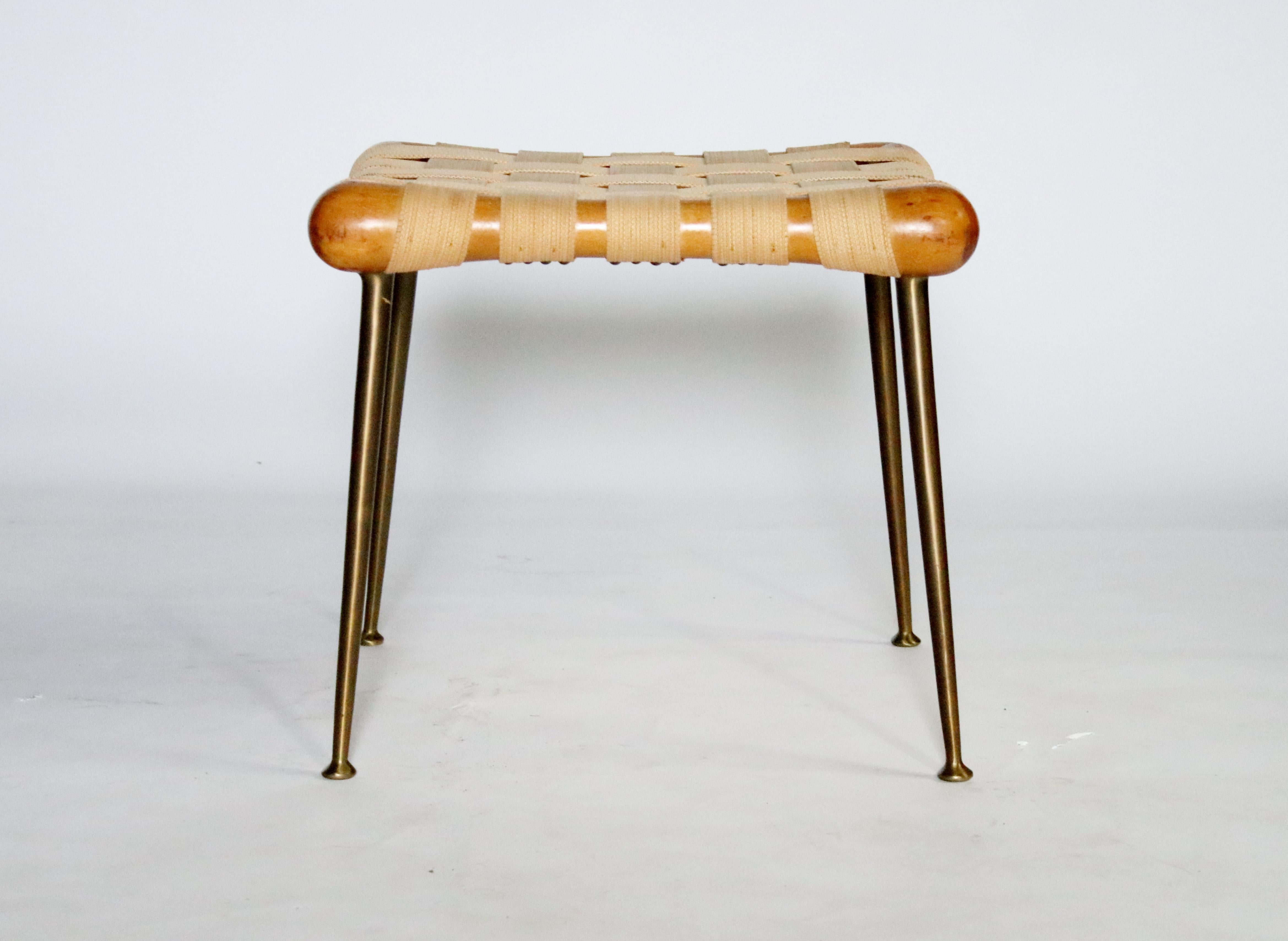 Strap bench Model #1730 in walnut and original webbing on brass tapered legs designed by T.H. Robsjohn Gibbings for Widdicomb, 1950s. Labelled.