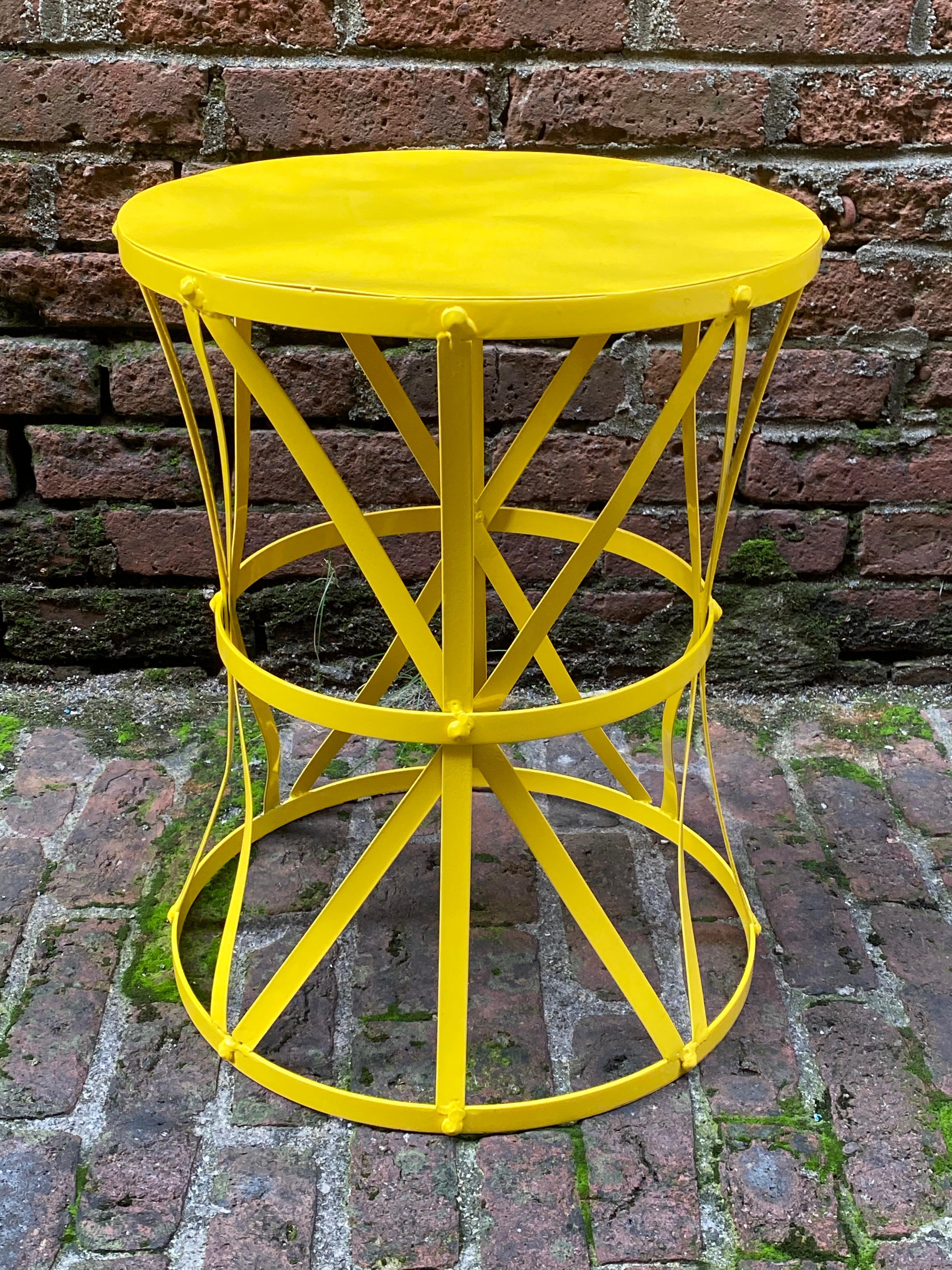 Vintage late 1960s metal drum table. Freshly powder coated in a vibrant canary yellow. Good overall condition with some minor imperfections due to age. Structurally sound and sturdy, Some of the straps are not perfectly straight. All welds and