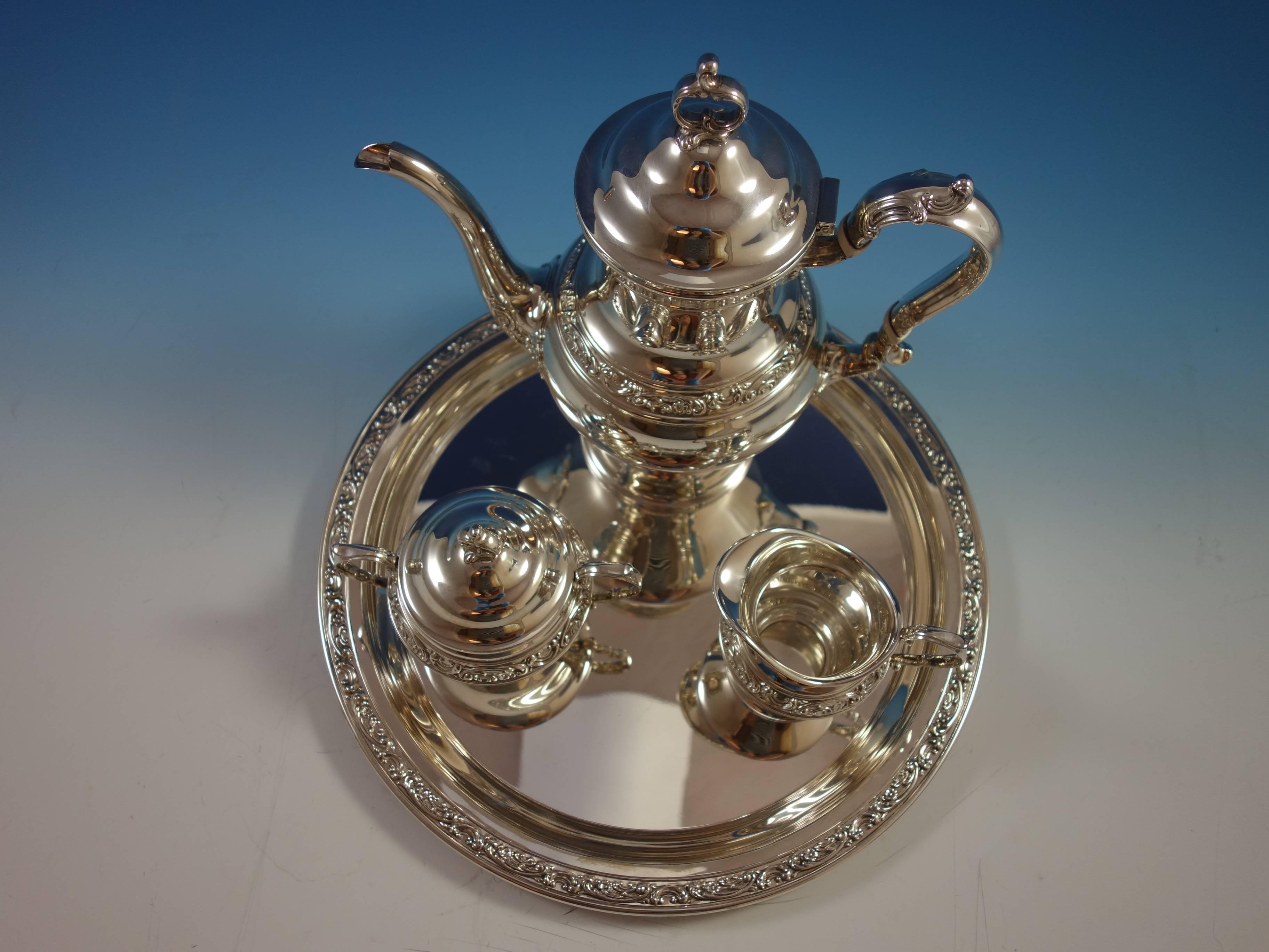 Beautiful Strasbourg by Gorham sterling silver three-piece tea set with an elegant round tray. The tea set is not monogrammed. The tray is marked #1230, measures 5/8