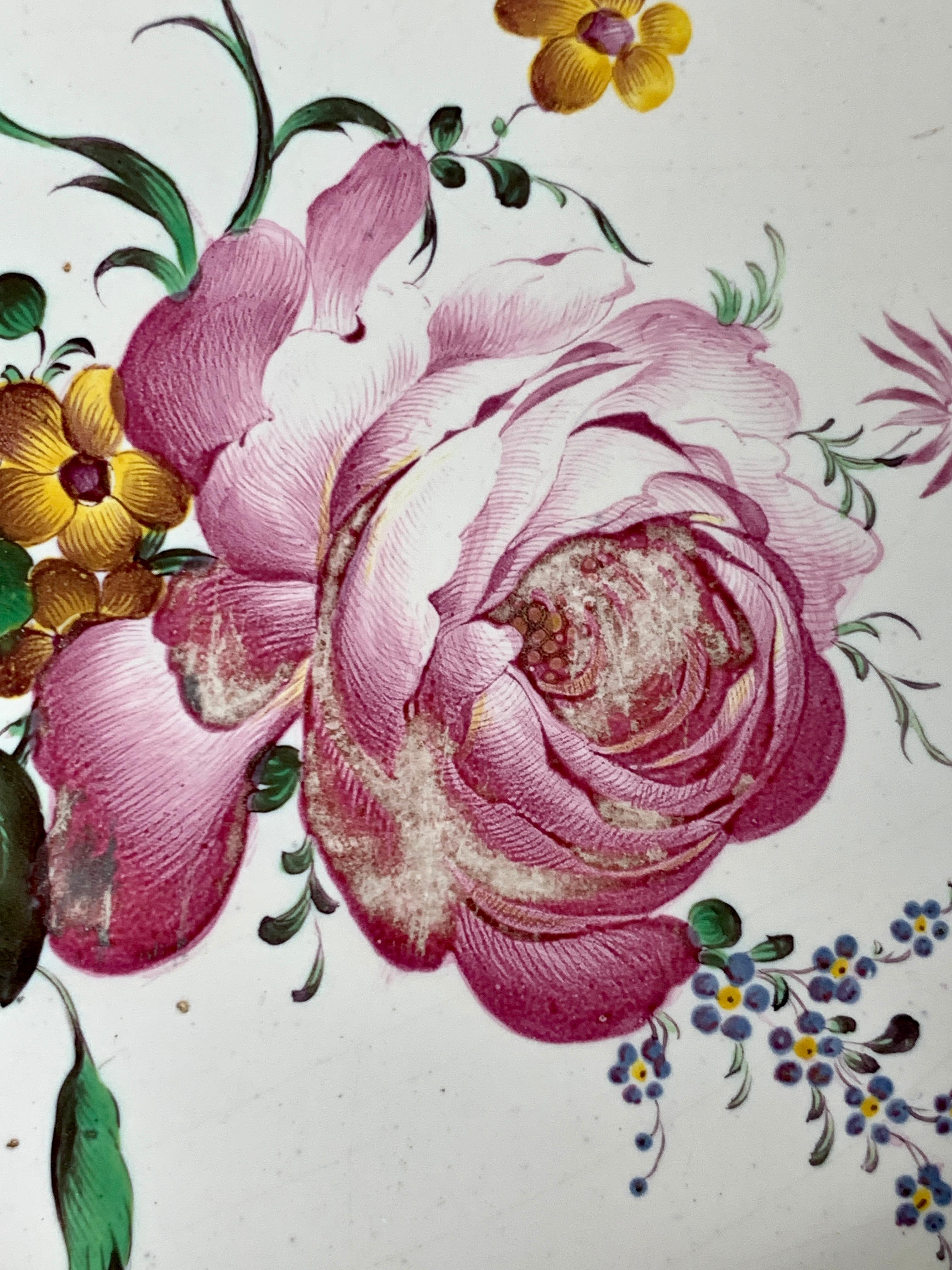 This 18th century faience dish was hand painted in the factory of Paul Hannong in Strasbourg, France. The flowers are exquisite.
I would almost call them delicious! Paul Hannong, and his brother Joseph, were known for the fabulous flower painting