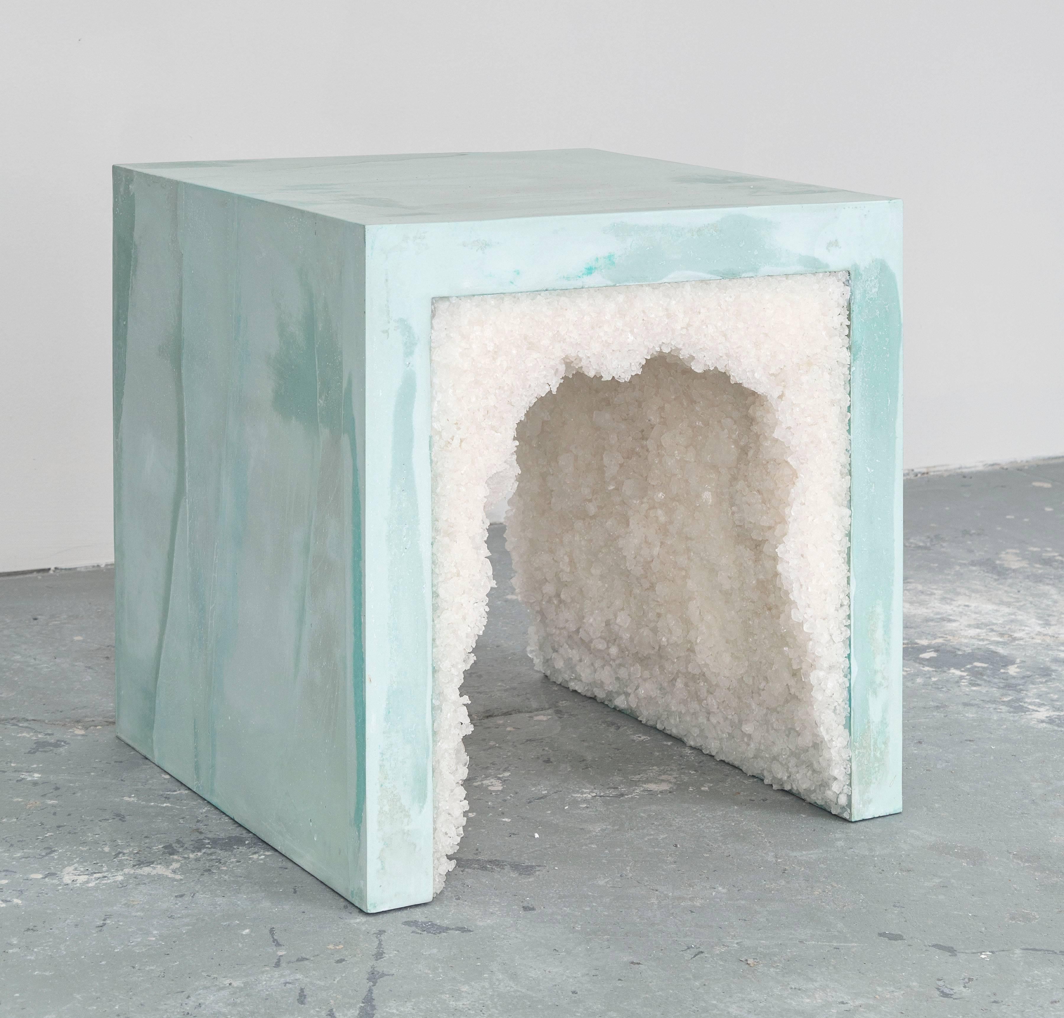 Composed from a combination of materials, the angular side table consists of a hand-dyed cement exterior and a white rock salt interior. Packed by hand within the smooth ombre of celadon cement, the granules form an organic texture to contrast the