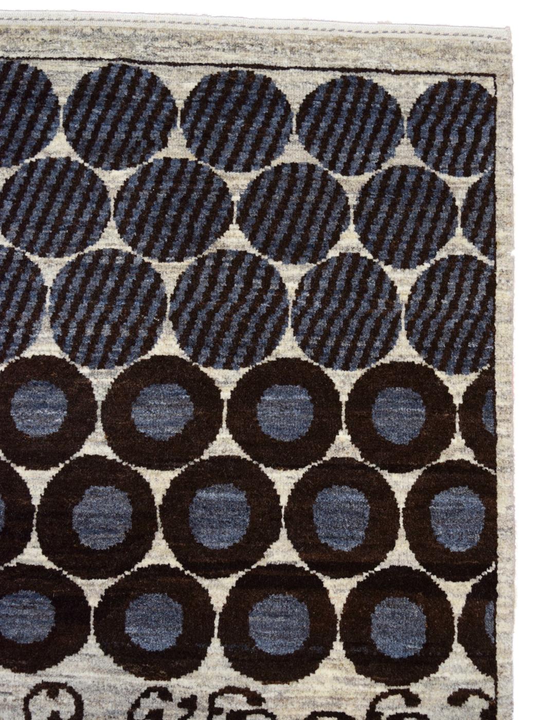 Measuring 2’7” x 5’4”, this modern carpet from the Orley Shabahang Architectural collection, titled Strata, is hand-knotted in steel gray, dark brown, and cream wool. Its background of cream wool acts as the perfect setting for Strata’s rocky