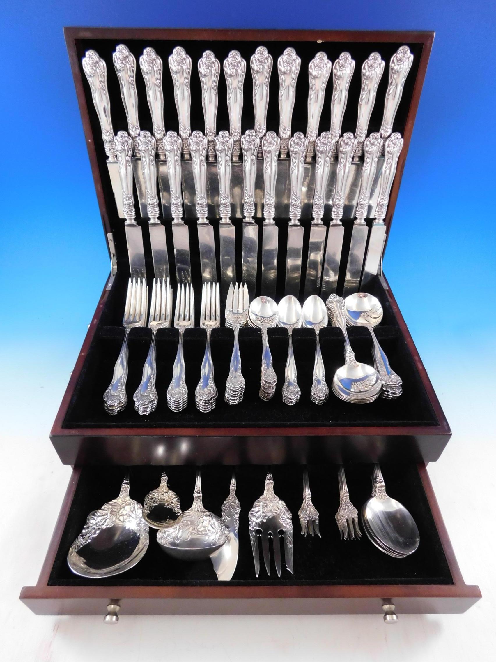 Rare stratford by International, circa 1902, sterling silver flatware set with Art Nouveau carnation motif, 108 pieces. This set includes:

12 dinner knives w/blunt plated blades, 9 3/4