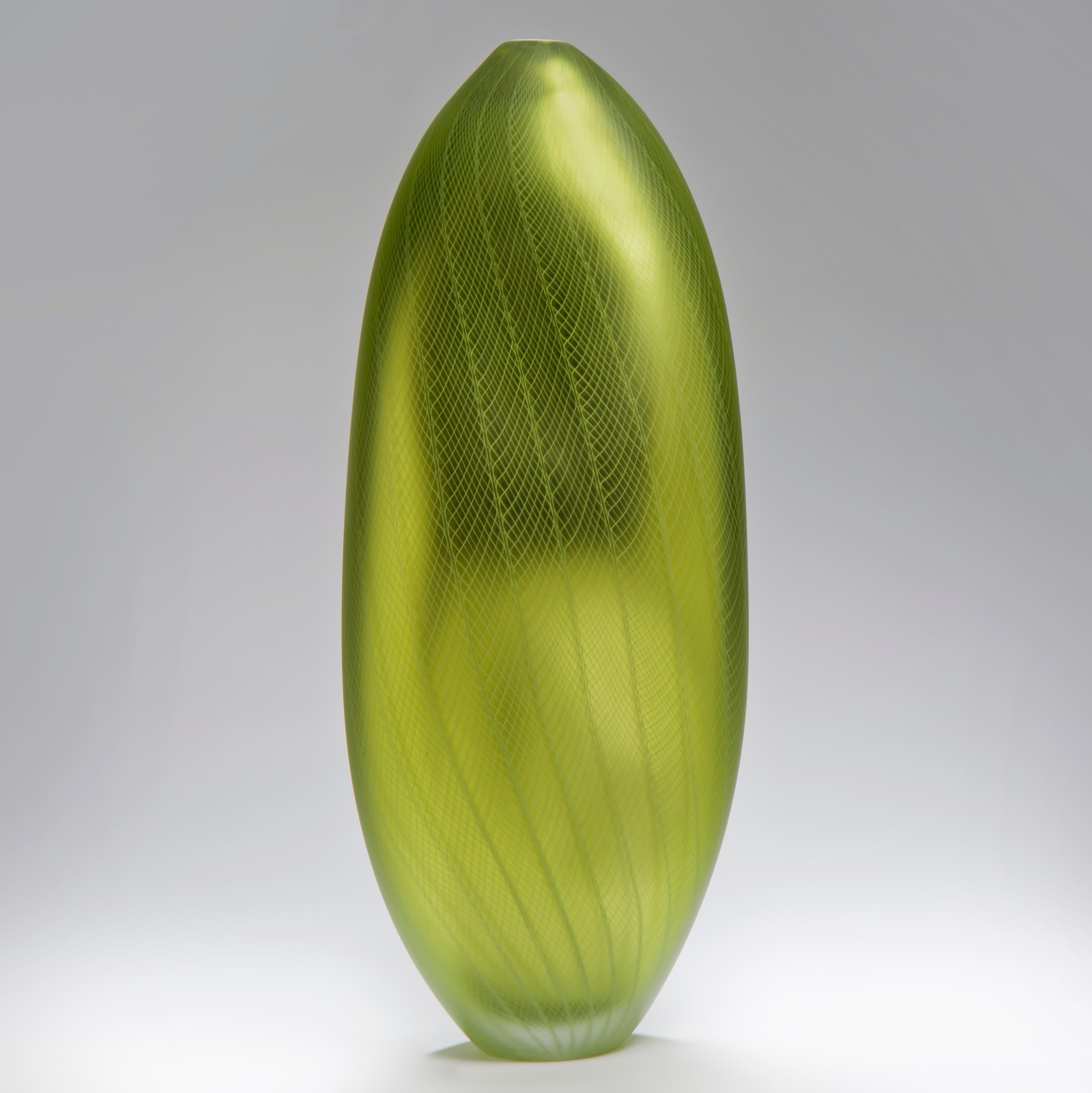 Stratiform Aerugo 1.0.001 is a unique hand-blown glass vessel with fine white filigree cane detail created by the British artist Liam Reeves. Hand blown in bright lime green glass, the interior has a mirrored finish, which results in a beautiful